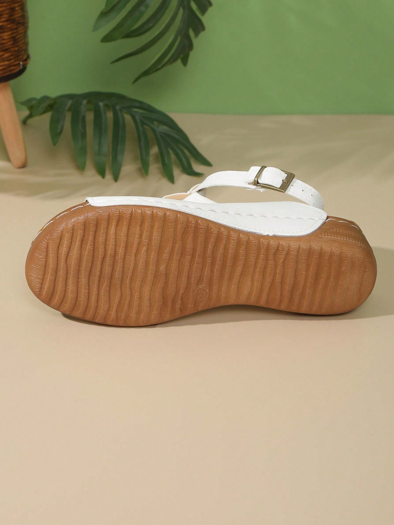 Women's open-toe platform wedge beach sandals with thick sole, stitching detail, floral accents, buckle closure, and removable adjustable shoelaces.