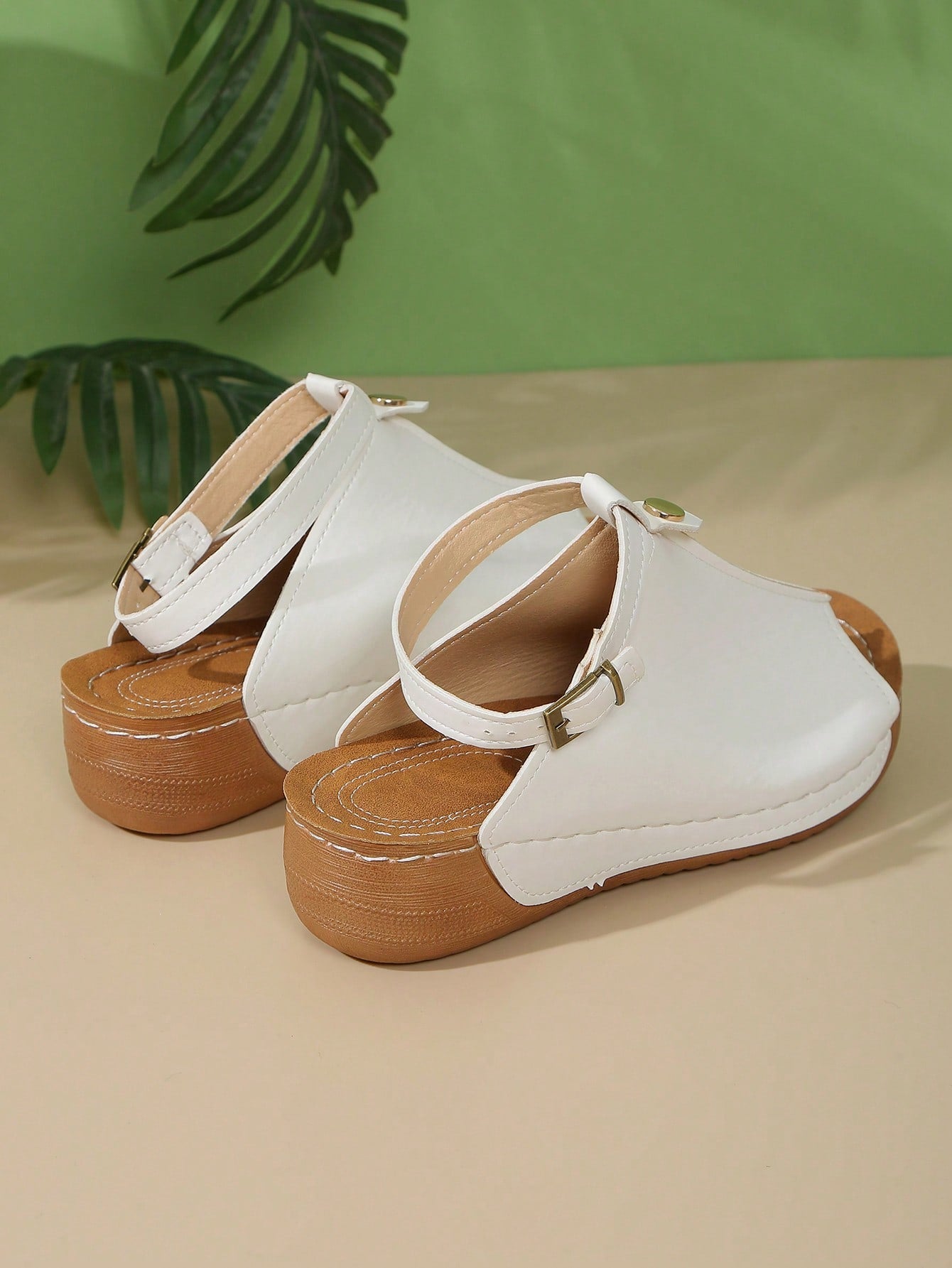 Women's open-toe platform wedge beach sandals with thick sole, stitching detail, floral accents, buckle closure, and removable adjustable shoelaces.