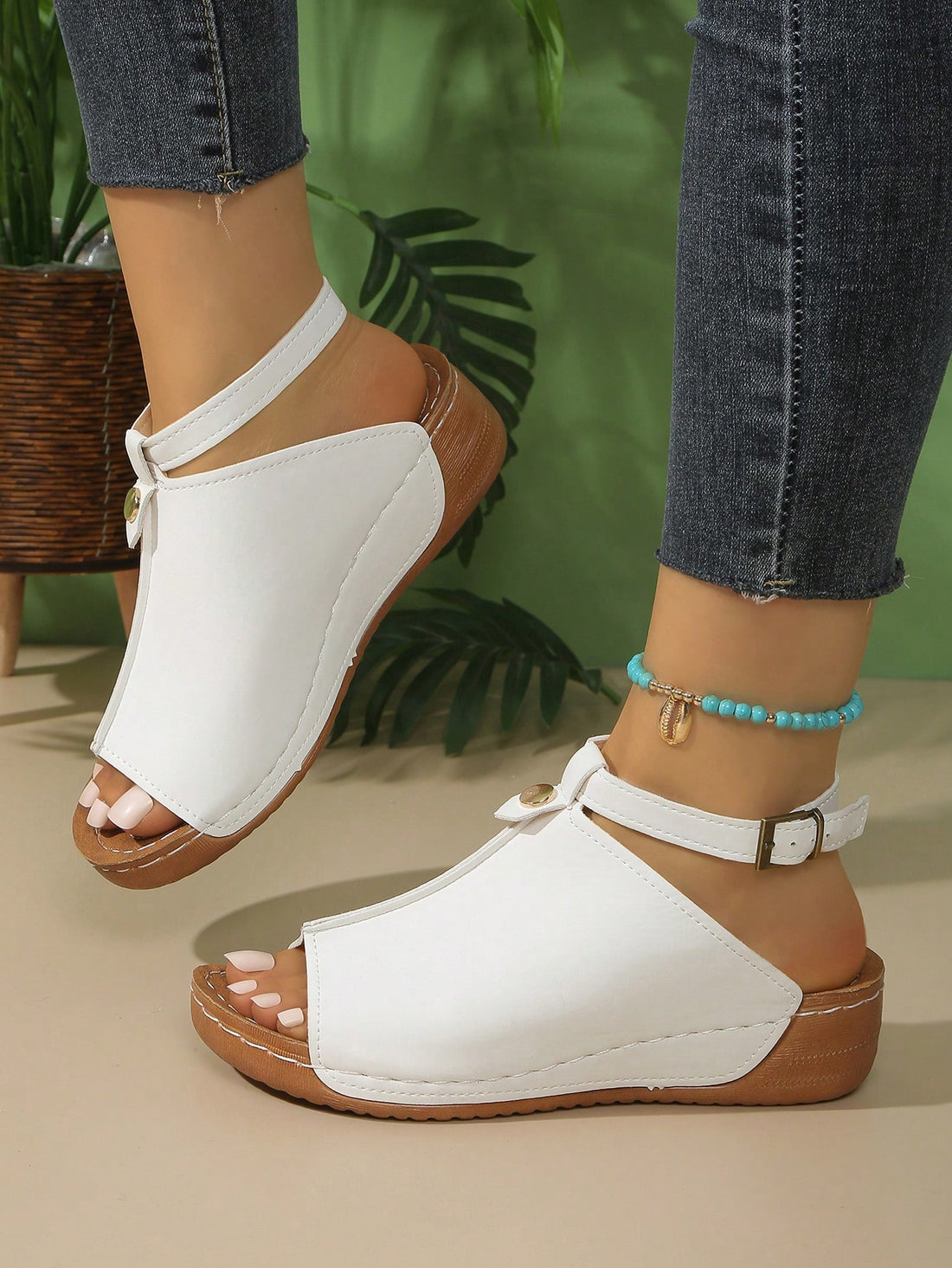 Women's open-toe platform wedge beach sandals with thick sole, stitching detail, floral accents, buckle closure, and removable adjustable shoelaces.