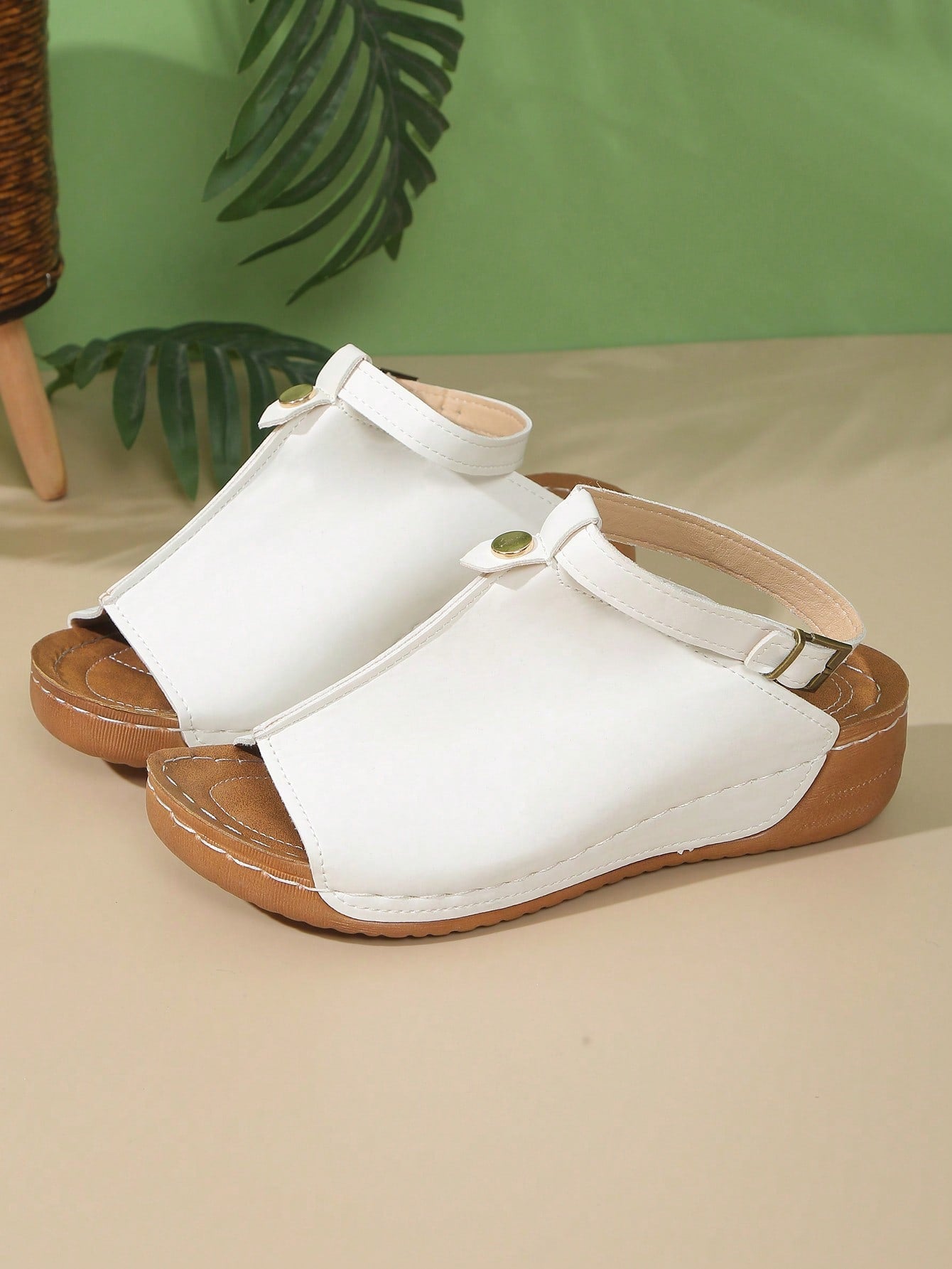 Women's open-toe platform wedge beach sandals with thick sole, stitching detail, floral accents, buckle closure, and removable adjustable shoelaces.