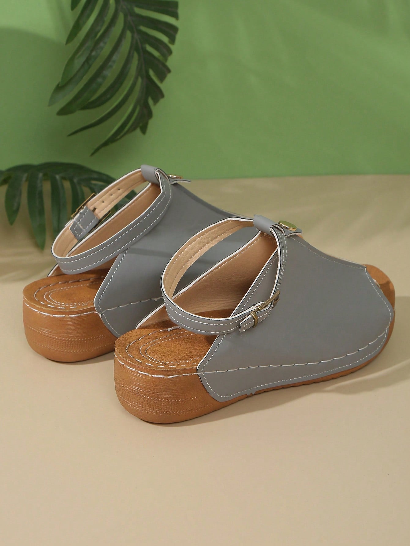 Women's open-toe platform wedge beach sandals with thick sole, stitching detail, floral accents, buckle closure, and removable adjustable shoelaces.