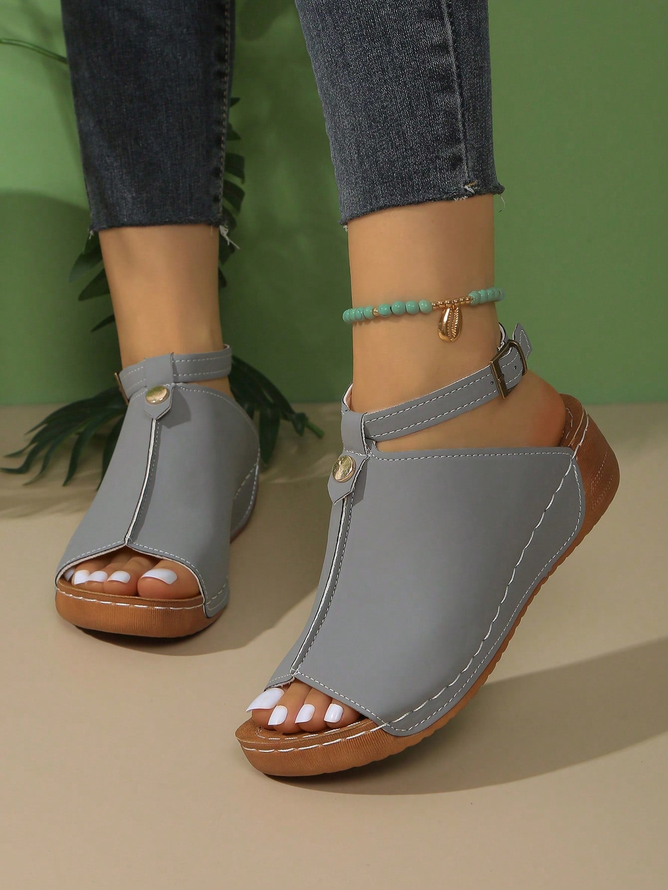 Women's open-toe platform wedge beach sandals with thick sole, stitching detail, floral accents, buckle closure, and removable adjustable shoelaces.