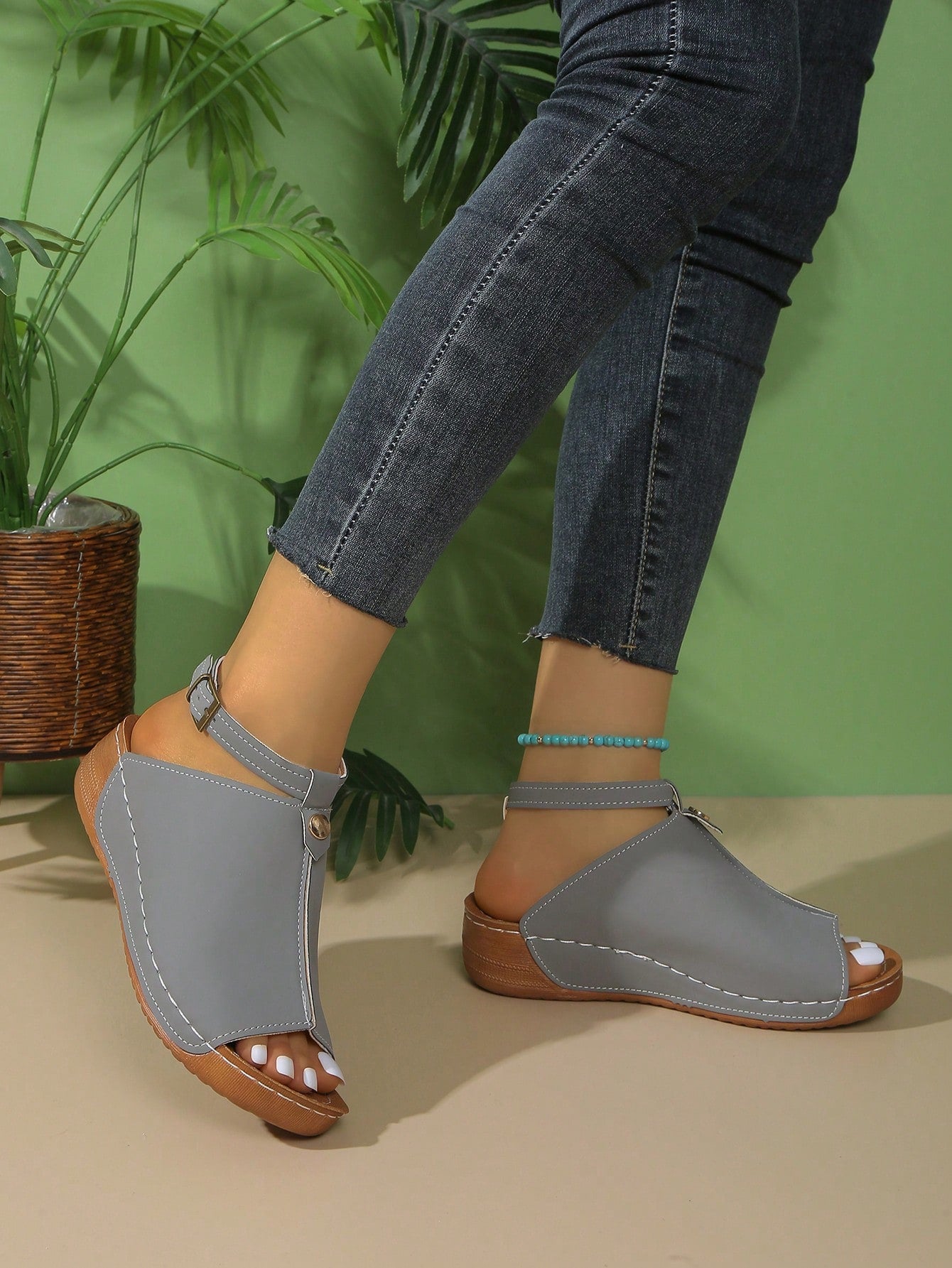Women's open-toe platform wedge beach sandals with thick sole, stitching detail, floral accents, buckle closure, and removable adjustable shoelaces.