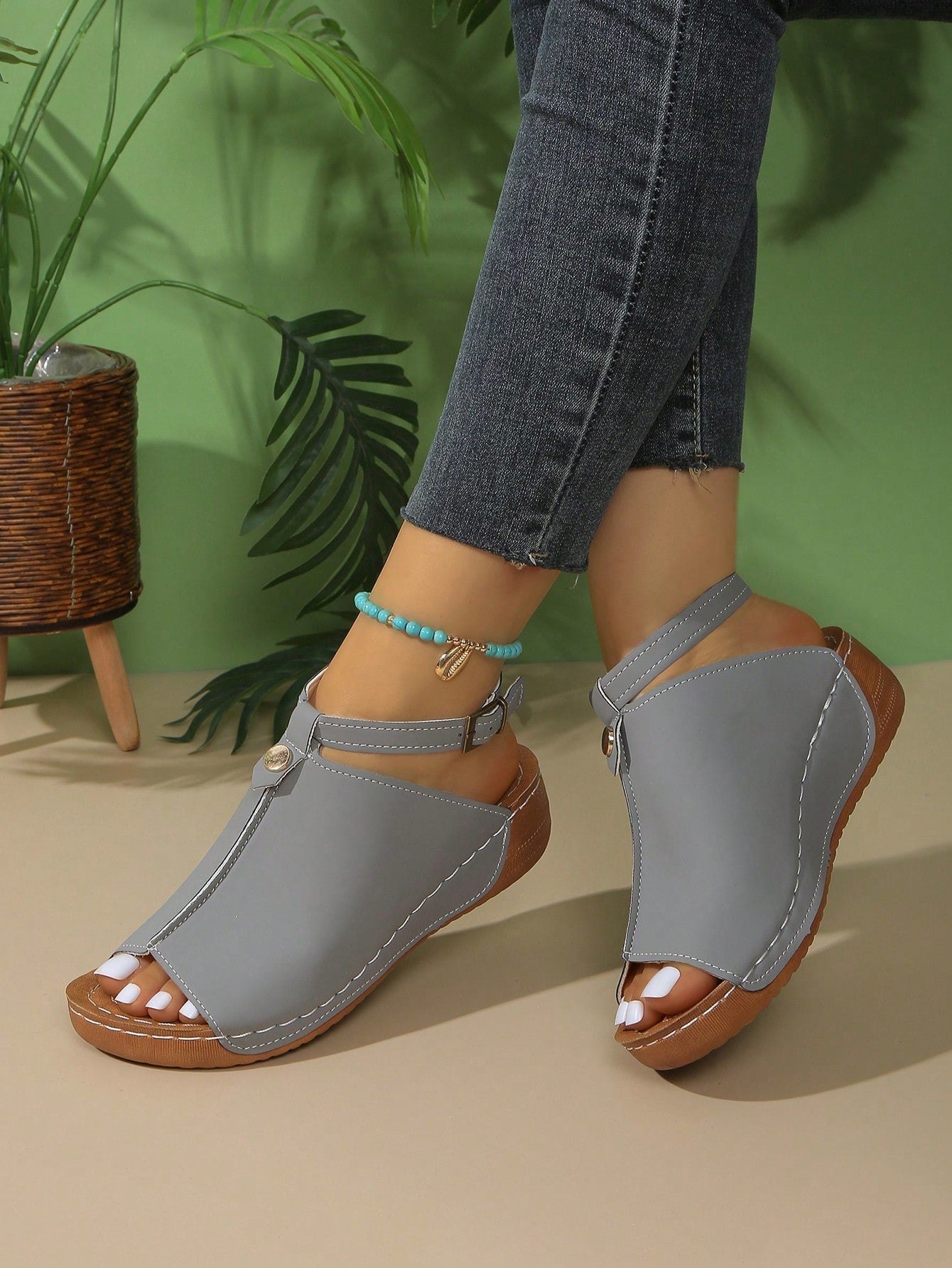 Women's open-toe platform wedge beach sandals with thick sole, stitching detail, floral accents, buckle closure, and removable adjustable shoelaces.