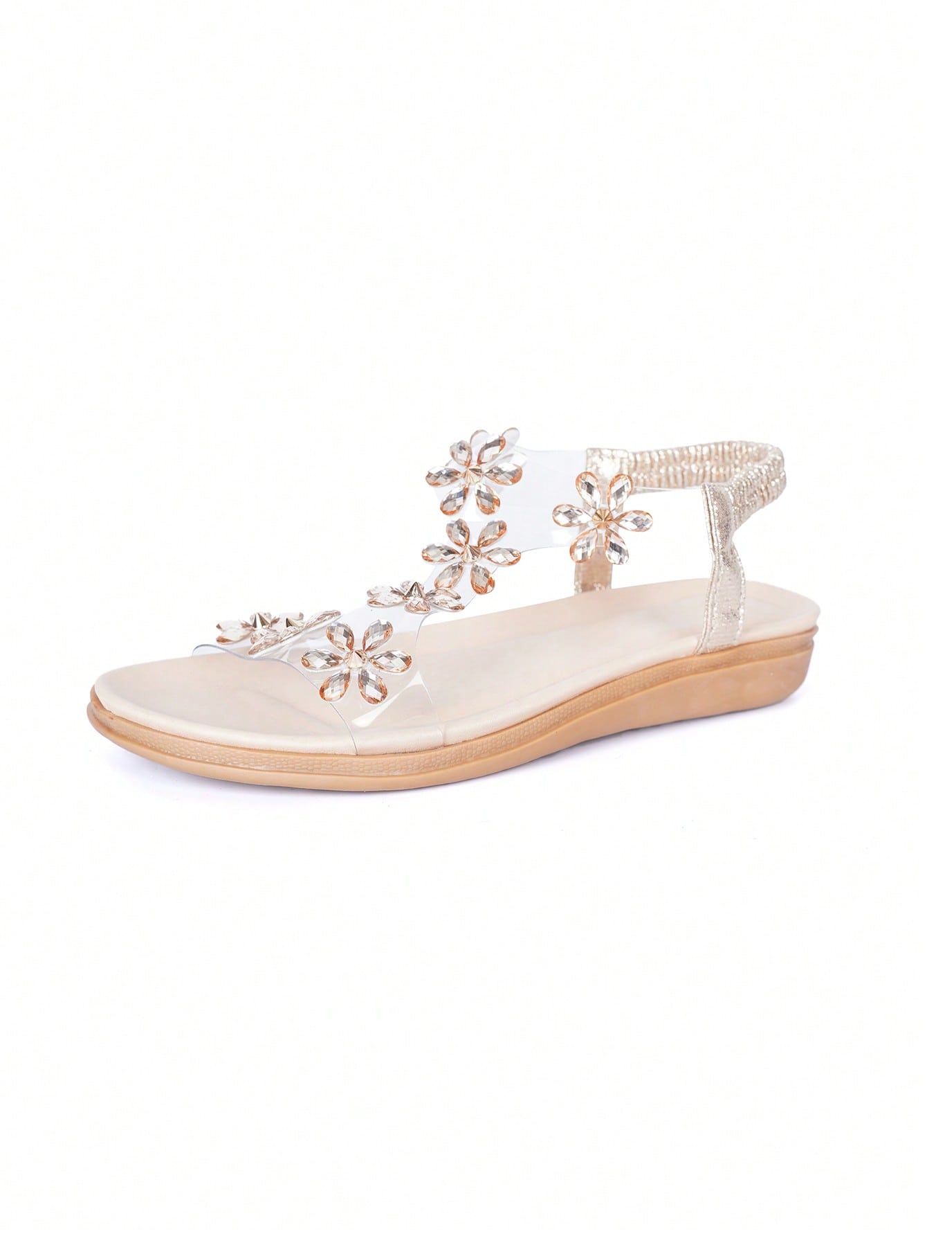 Women’s transparent flat sandals featuring crystal flower rhinestone decor, open toe design, and ankle strap on a flat anti-slip sole.
