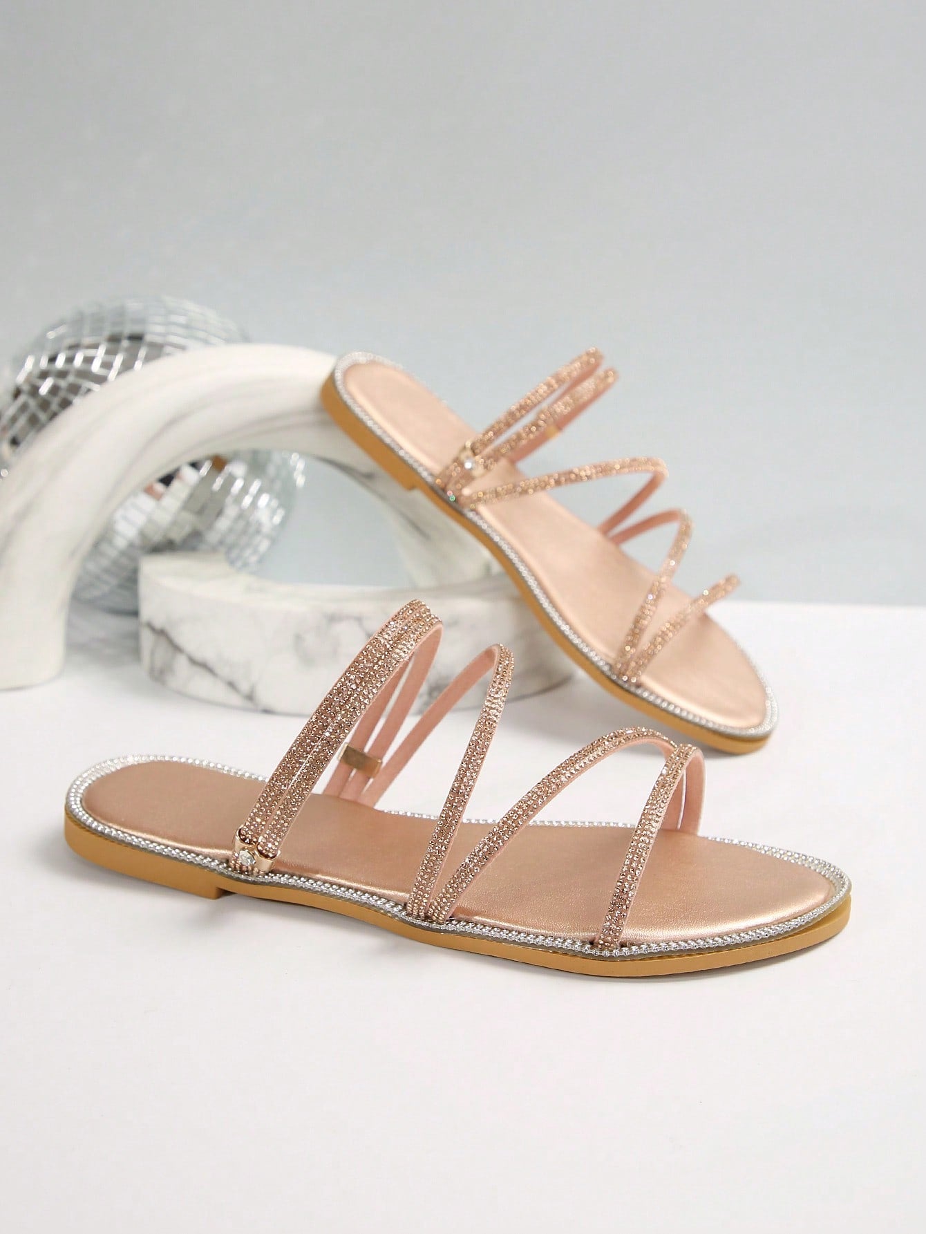 Women's flat open-toe sandals featuring braided multi-strap detailing in a solid color, designed for everyday wear, beach outings, parties, and summer events.