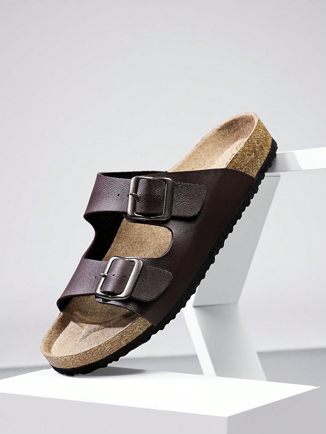 Unisex slip-on footbed slide sandals with adjustable buckle straps, open toe, and flat sole for casual home and outdoor wear.
