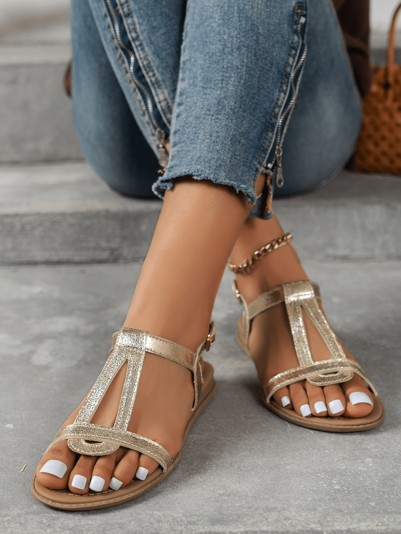 Women’s flat sandals with multiple straps, open toe front, and ankle strap buckle, featuring a plain design with glitter accents in a beach vacation style.