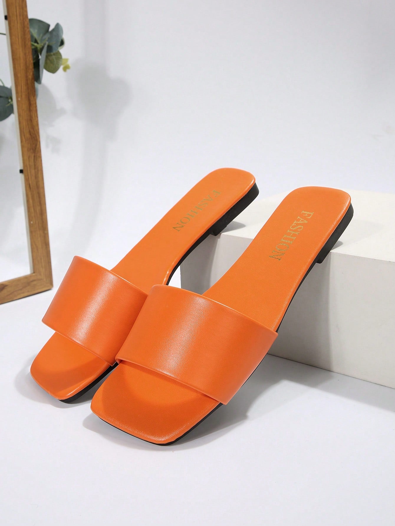 Women's flat slide sandals with a minimalist strap design, square open toe, and slip-on style for casual indoor and outdoor wear.