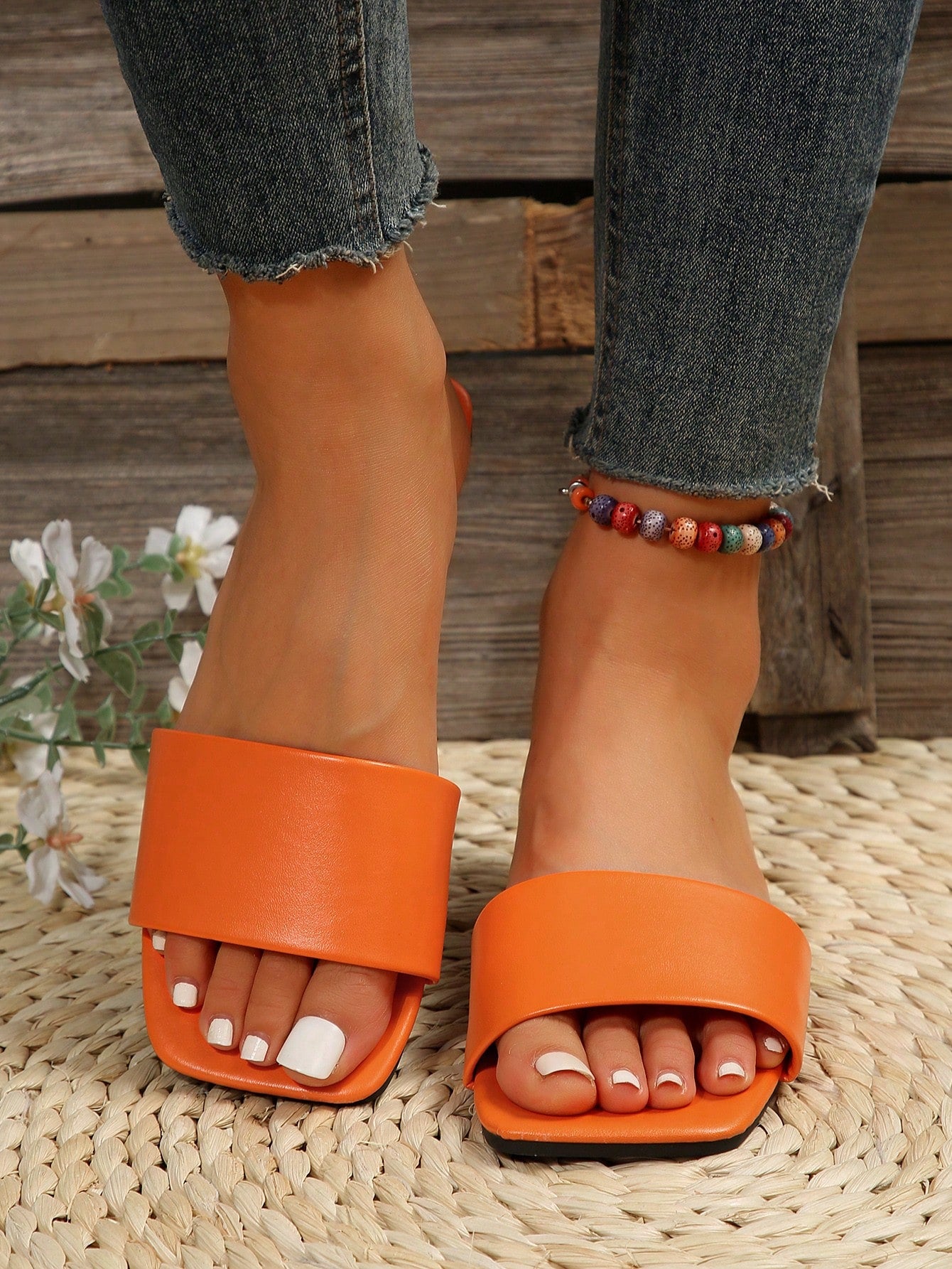 Women's flat slide sandals with a minimalist strap design, square open toe, and slip-on style for casual indoor and outdoor wear.