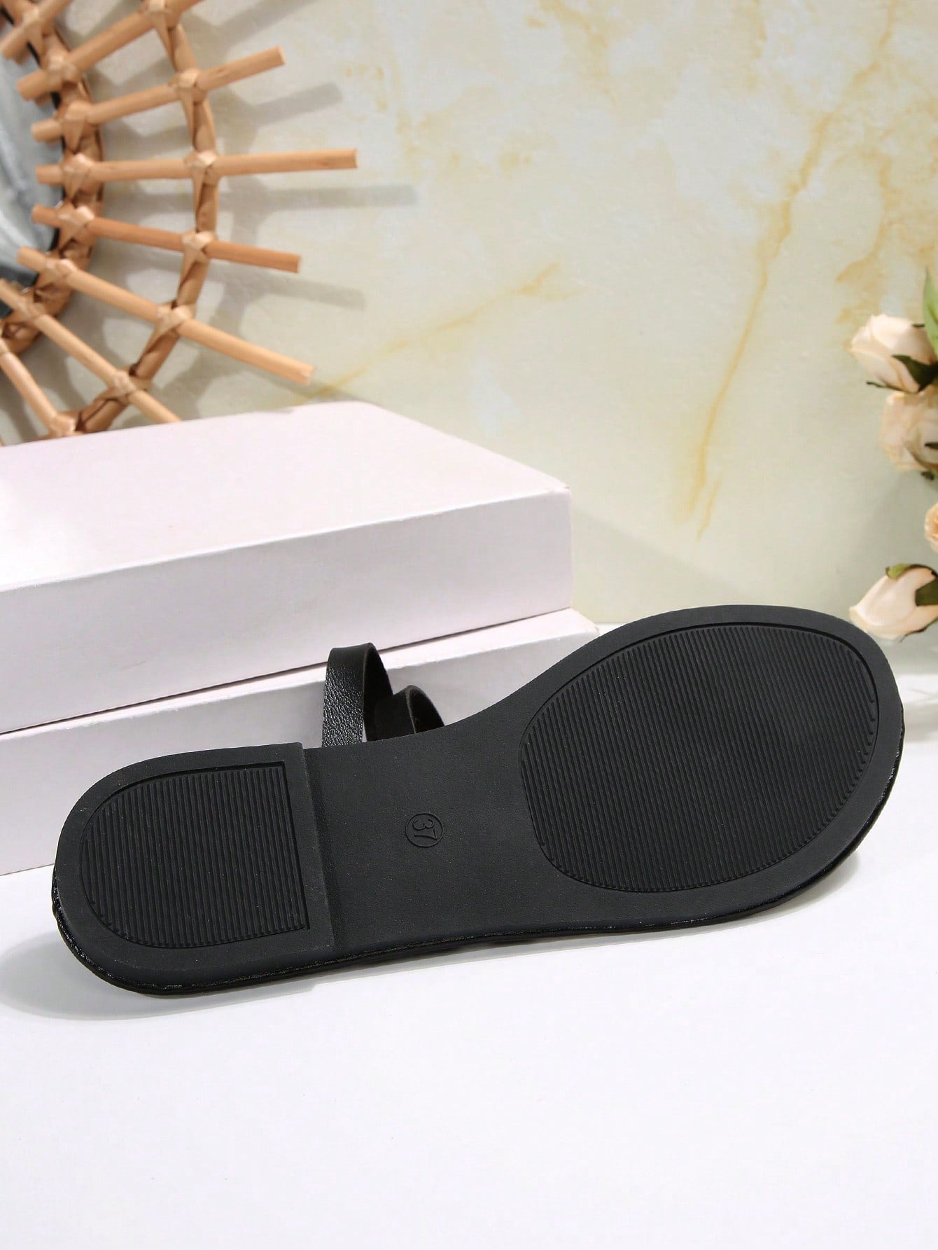 Women's flat slip-on sandal with toe ring and cross-over strappy upper, designed for casual beach and outdoor wear with an anti-slip sole.