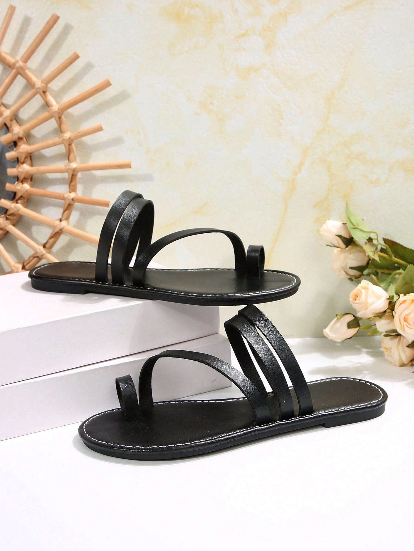 Women's flat slip-on sandal with toe ring and cross-over strappy upper, designed for casual beach and outdoor wear with an anti-slip sole.