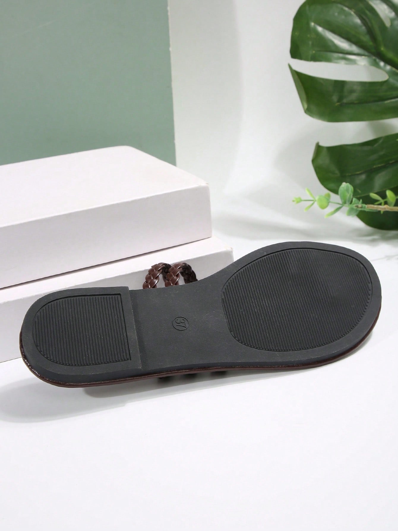 Women's flat slip-on sandal with toe ring and cross-over strappy upper, designed for casual beach and outdoor wear with an anti-slip sole.