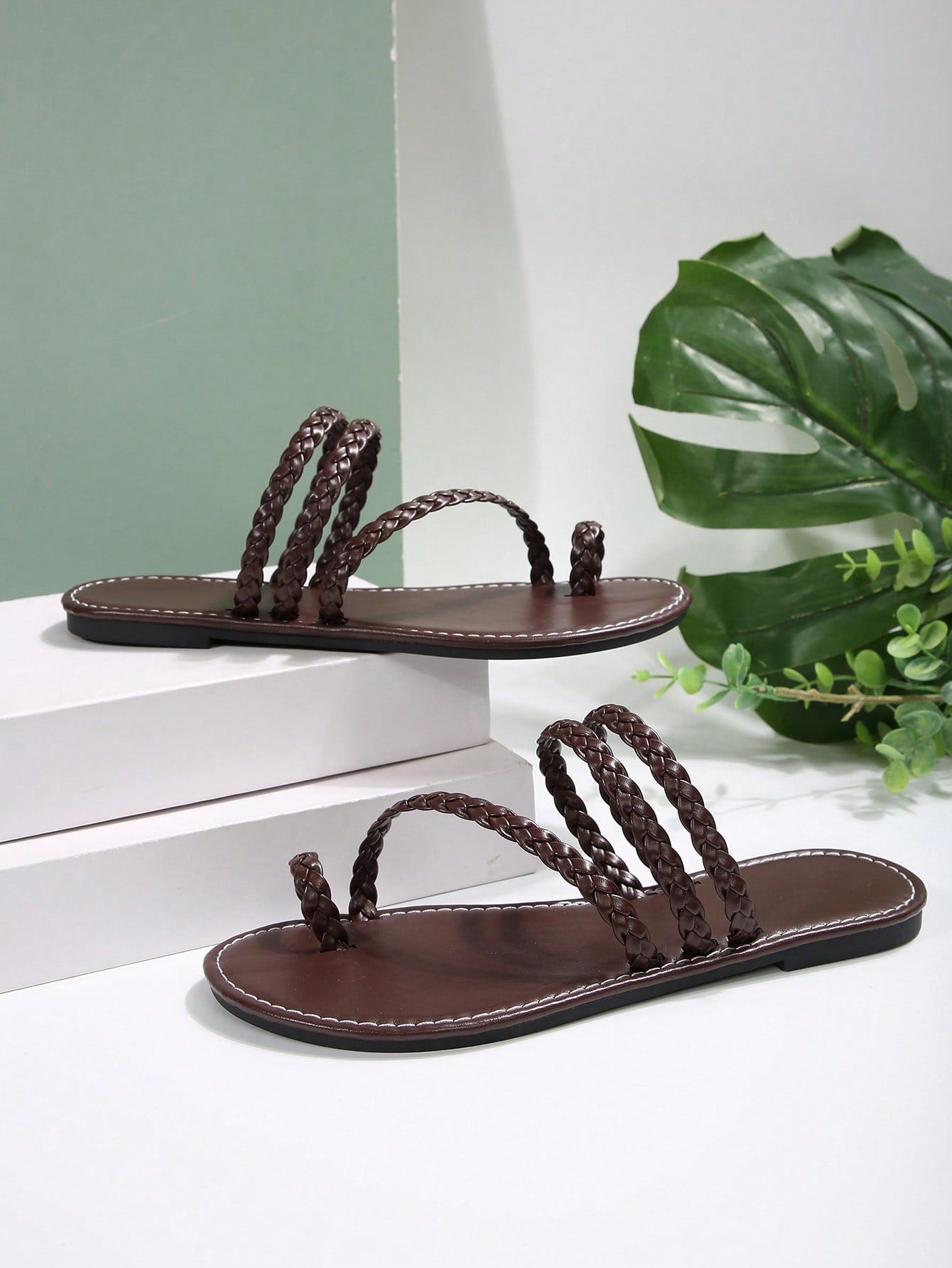 Women's flat slip-on sandal with toe ring and cross-over strappy upper, designed for casual beach and outdoor wear with an anti-slip sole.