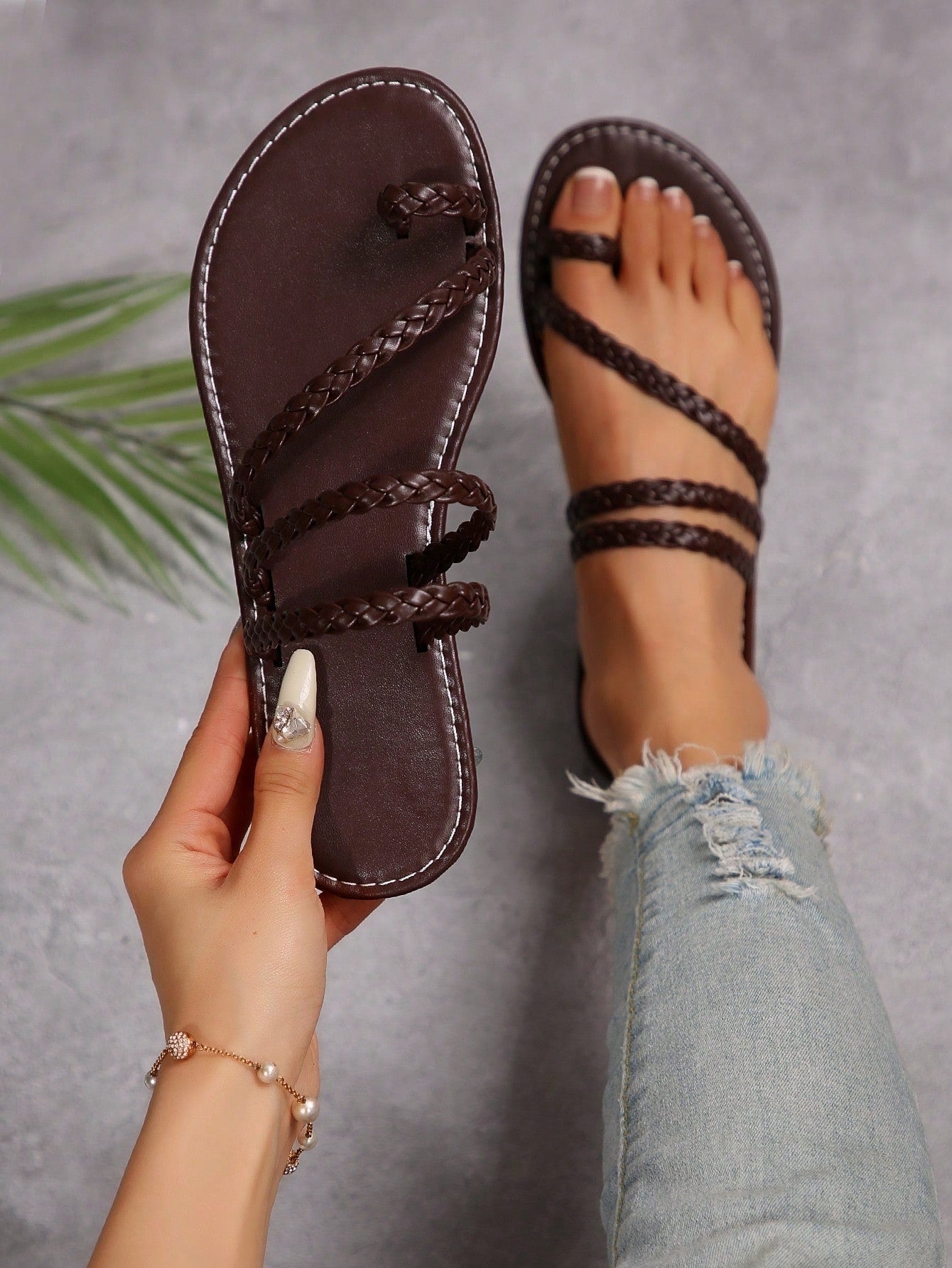 Women's flat slip-on sandal with toe ring and cross-over strappy upper, designed for casual beach and outdoor wear with an anti-slip sole.