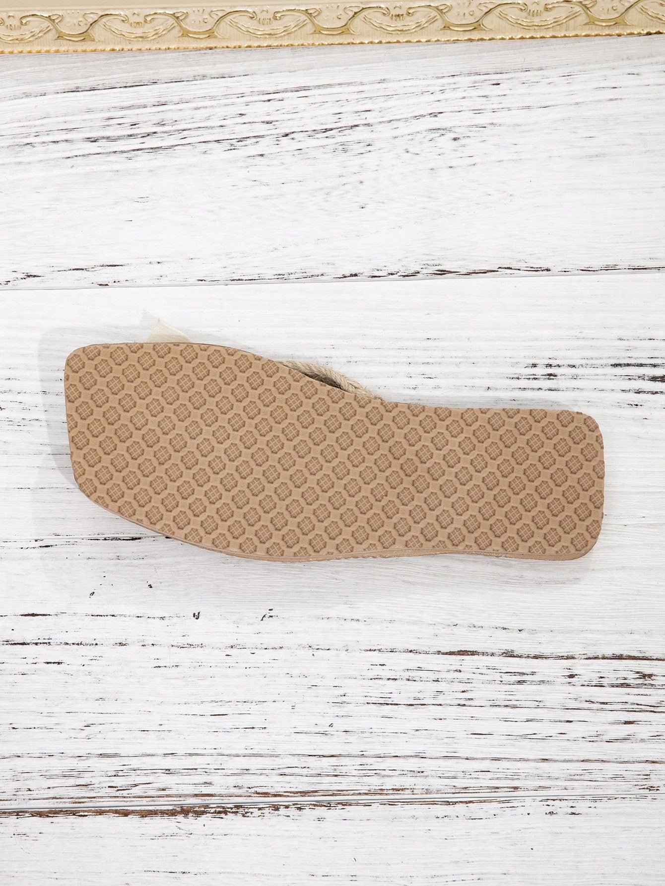 Women’s flat linen flip-flops with flower appliqué decor and sole, beach slipper style.