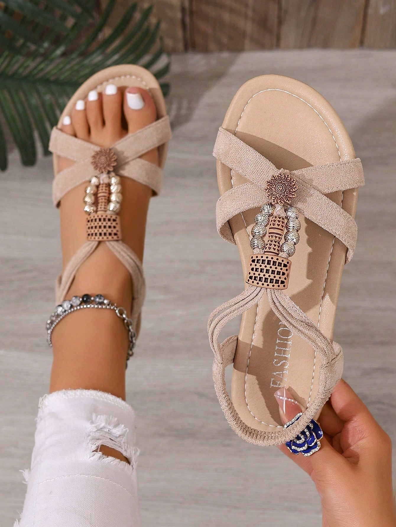 Women's bohemian flat slingback sandals with braided beaded details and open toe, designed for beach and vacation outfits.