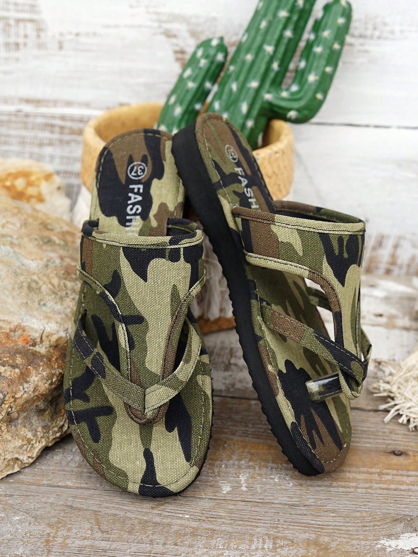 Women’s army green flat slide sandals with criss cross straps and open toe design, casual beach slippers with lightweight look.