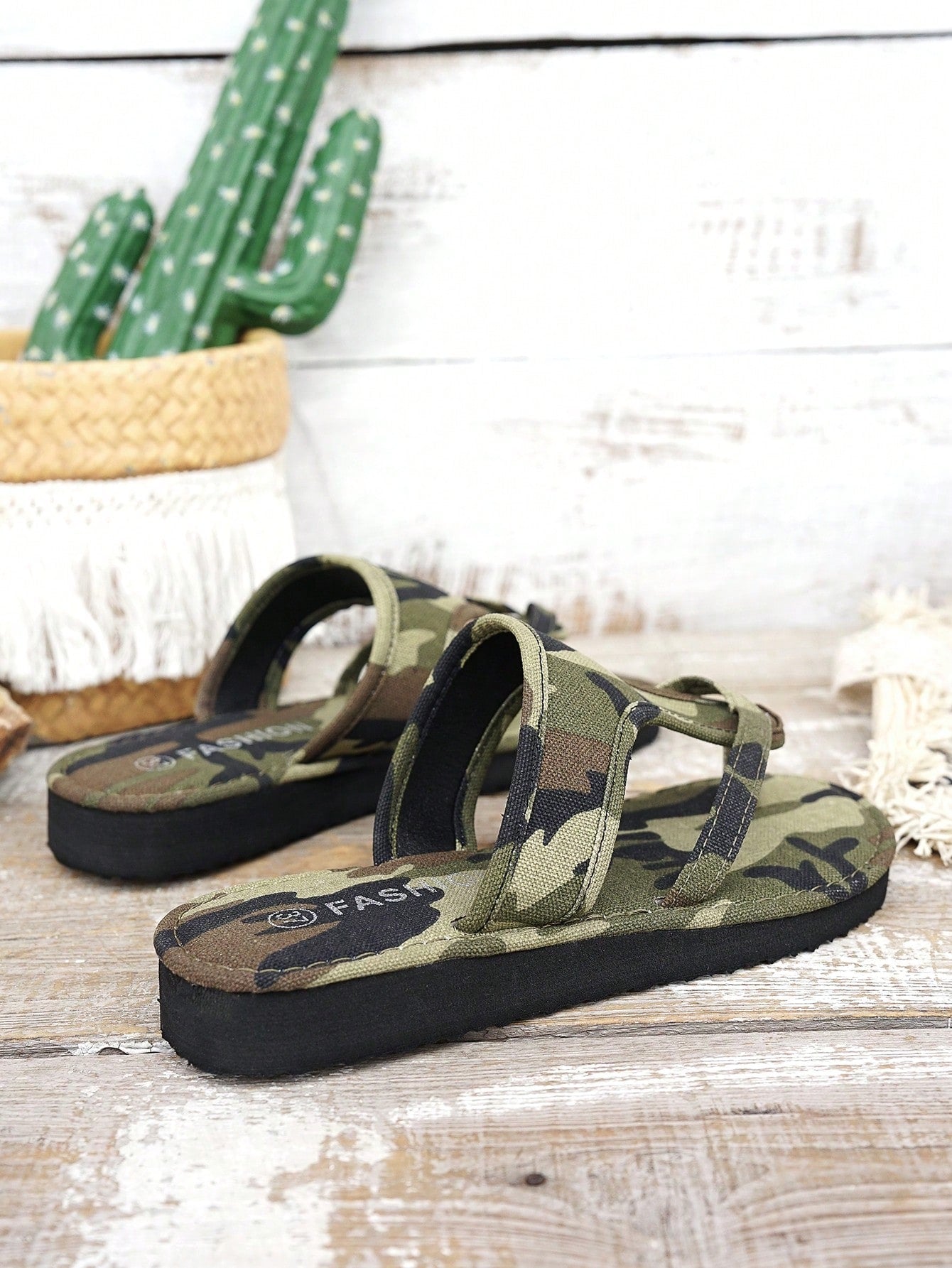 Women’s army green flat slide sandals with criss cross straps and open toe design, casual beach slippers with lightweight look.