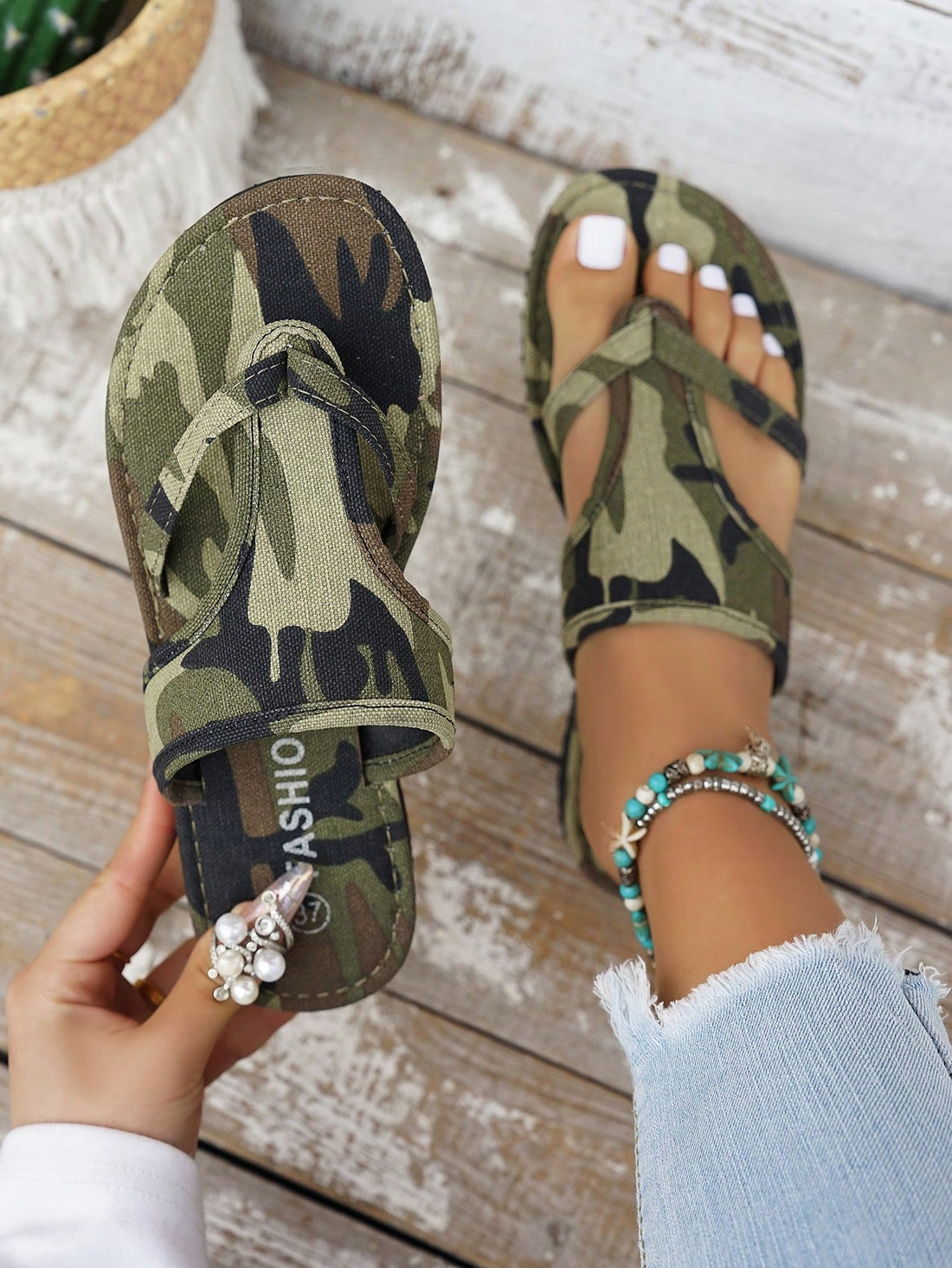 Women’s army green flat slide sandals with criss cross straps and open toe design, casual beach slippers with lightweight look.