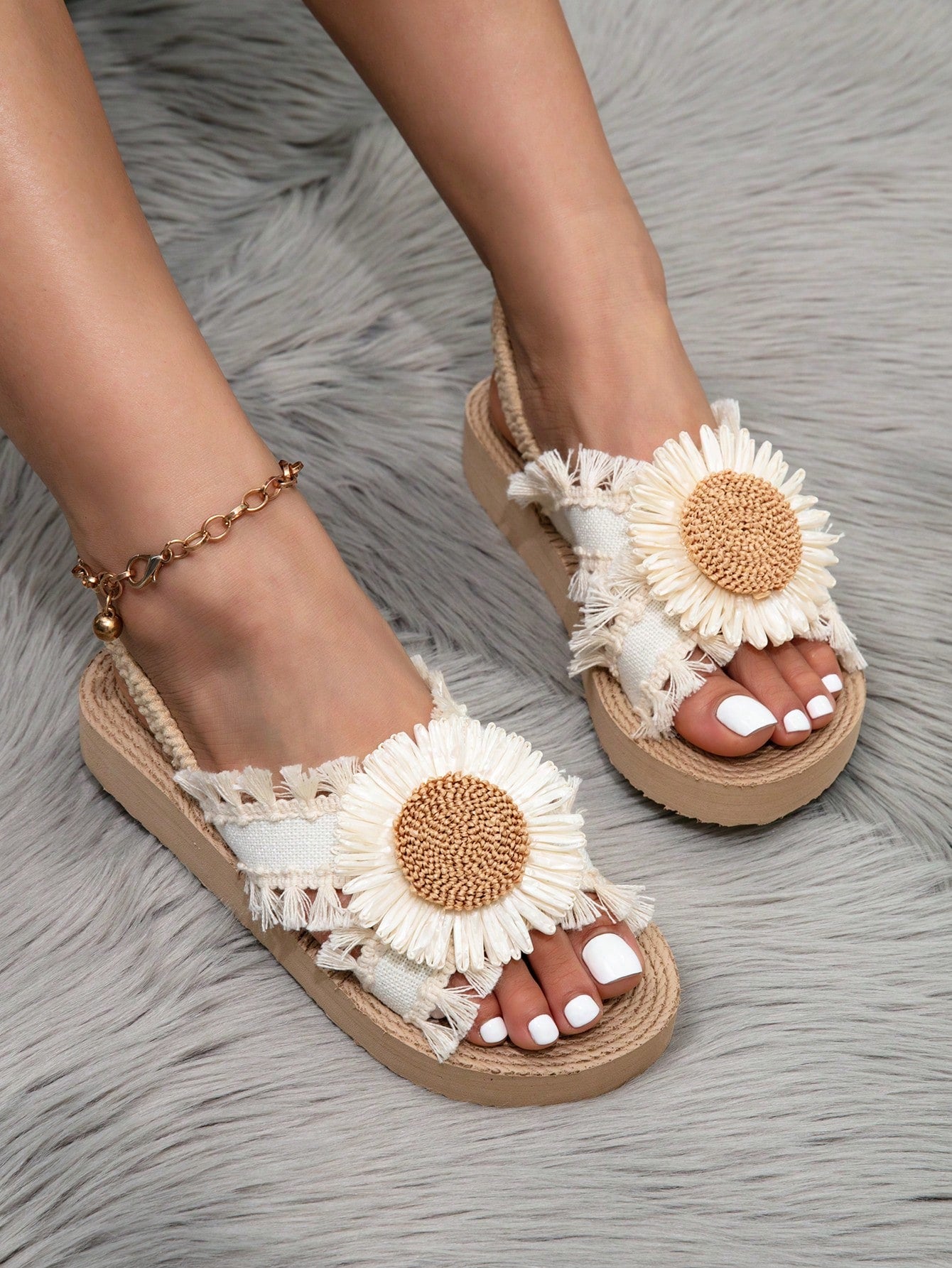 Women's open toe slip-on wedge sandals with criss cross straps and folk-custom styling, featuring raw hem, fringe, tassel, braid, and tape details.