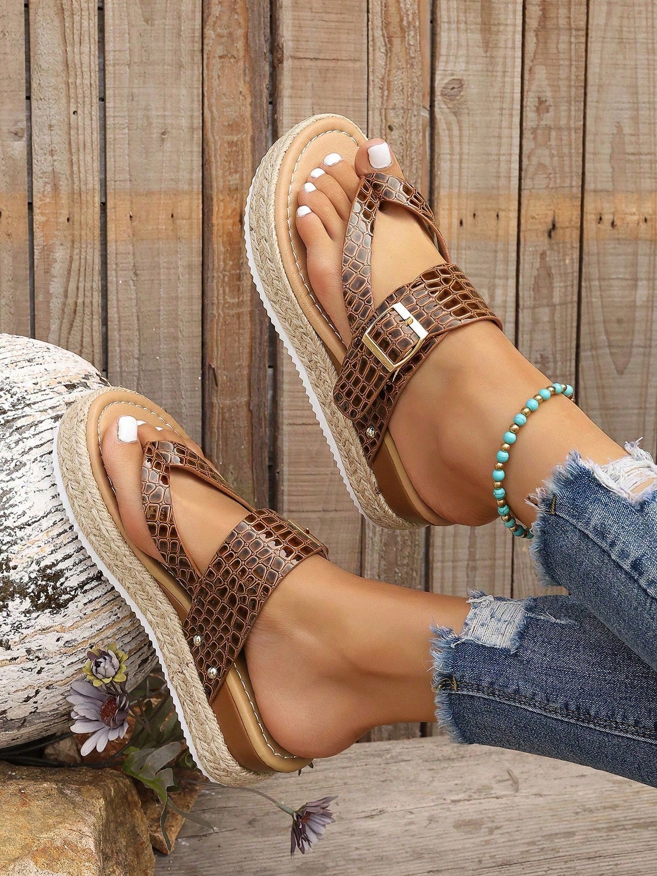 Women's thick sole flip flop sandals with adjustable buckle strap, toe post design, and flatform mid heel in a casual vacation style.