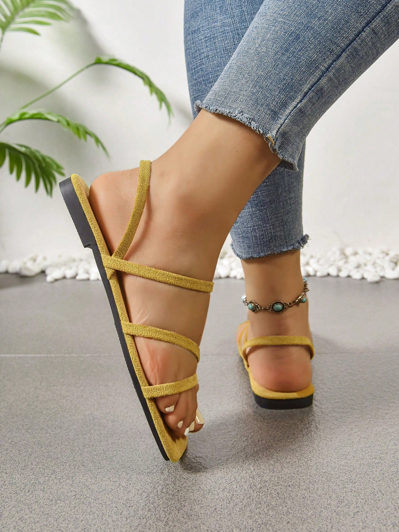 Women's flat sandals with a square open toe, crisscross front straps, and an elastic ankle strap, suitable for casual summer outdoor and beach vacation wear.