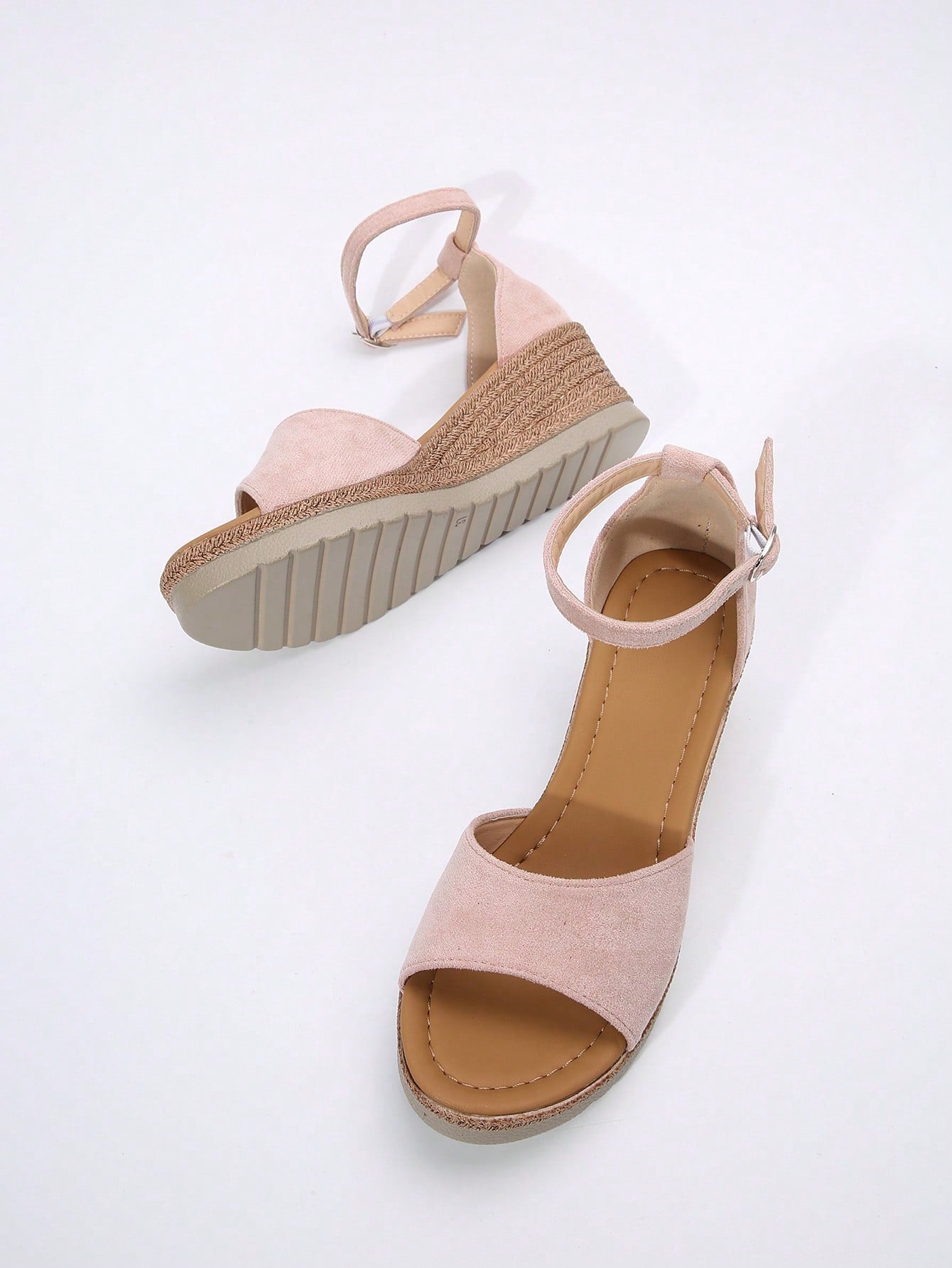 Women's classic wedge sandals featuring a peep open toe, ankle strap with buckle closure, mid wedge heel, and large bow detail in a bohemian beach style.