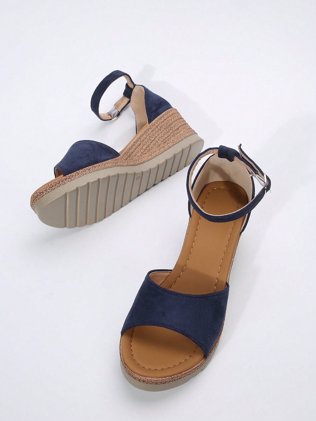 Women's classic wedge sandals featuring a peep open toe, ankle strap with buckle closure, mid wedge heel, and large bow detail in a bohemian beach style.