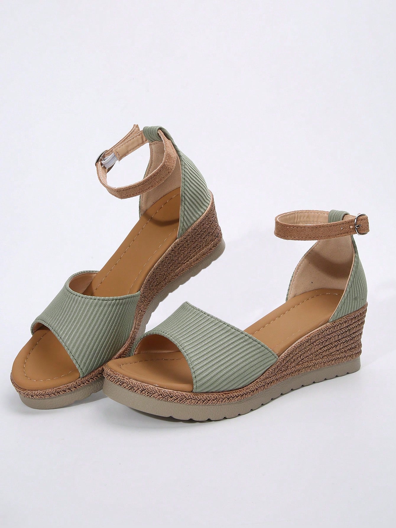 Women's classic wedge sandals featuring a peep open toe, ankle strap with buckle closure, mid wedge heel, and large bow detail in a bohemian beach style.