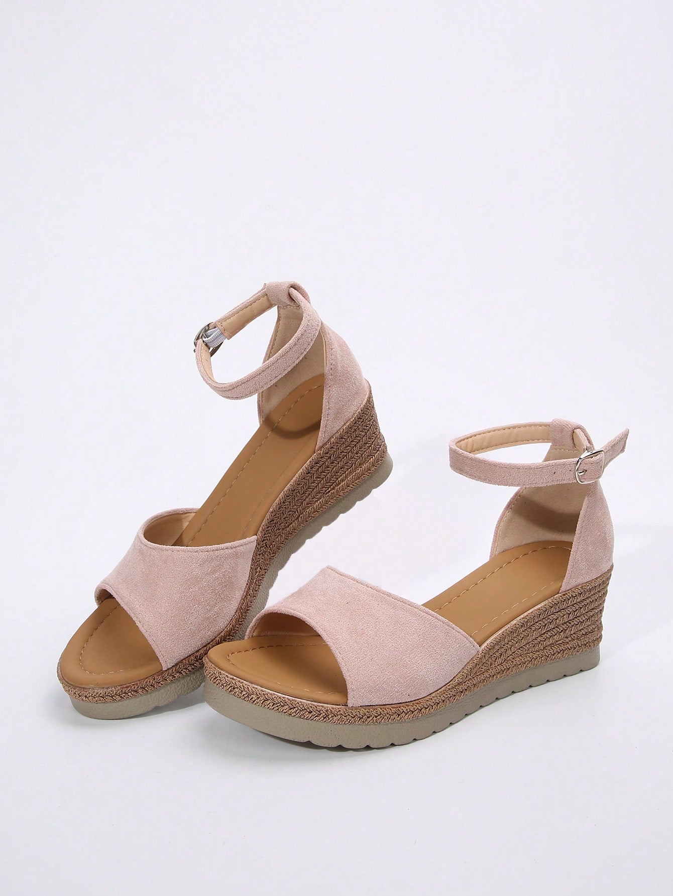 Women's classic wedge sandals featuring a peep open toe, ankle strap with buckle closure, mid wedge heel, and large bow detail in a bohemian beach style.