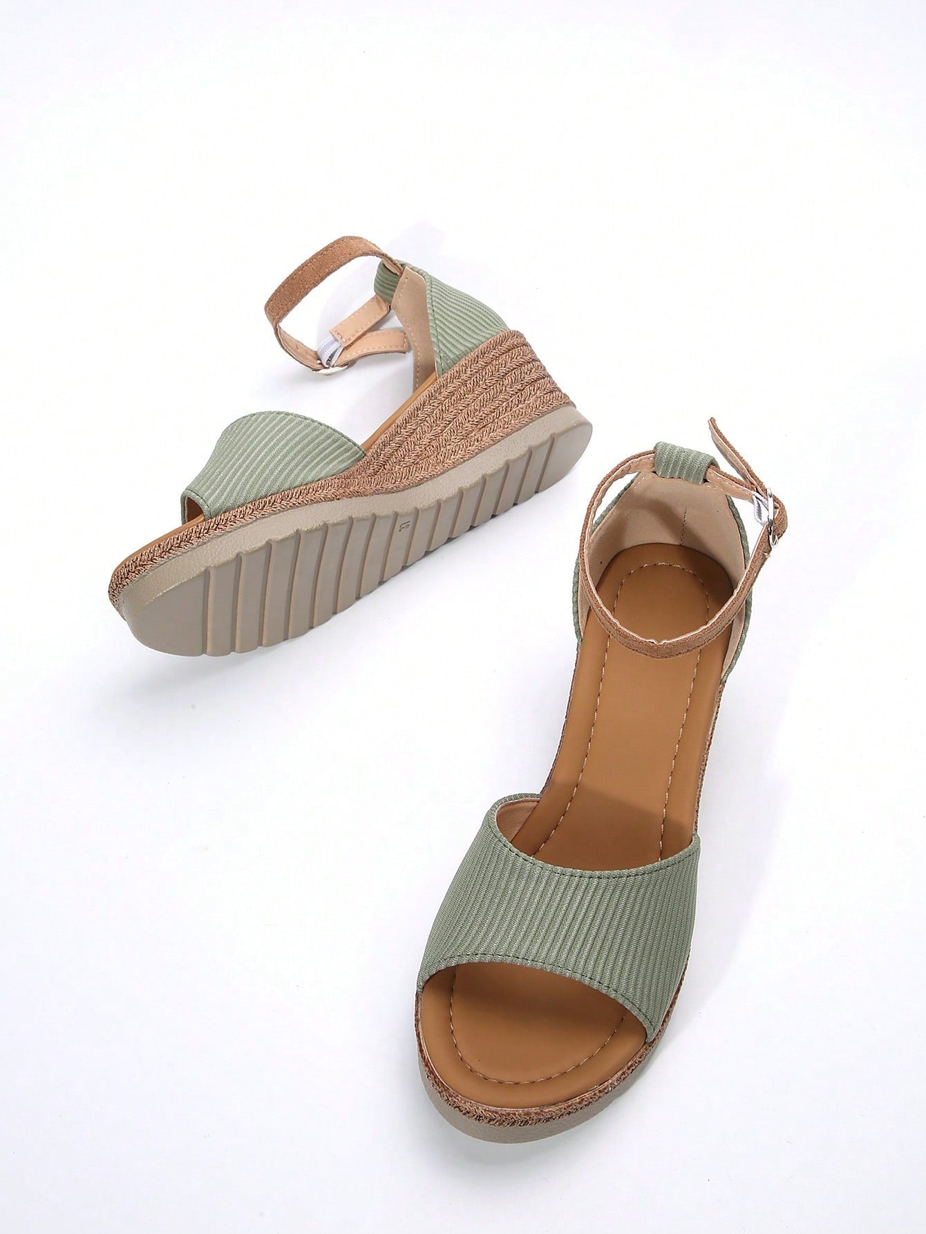 Women's classic wedge sandals featuring a peep open toe, ankle strap with buckle closure, mid wedge heel, and large bow detail in a bohemian beach style.