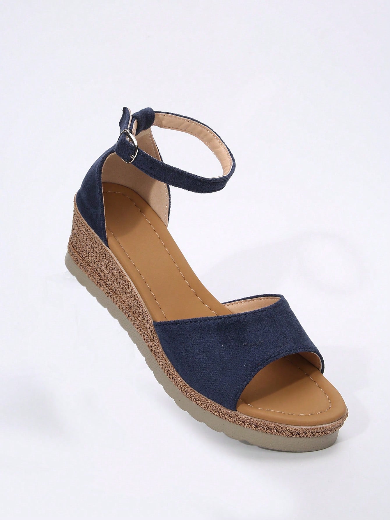 Women's classic wedge sandals featuring a peep open toe, ankle strap with buckle closure, mid wedge heel, and large bow detail in a bohemian beach style.