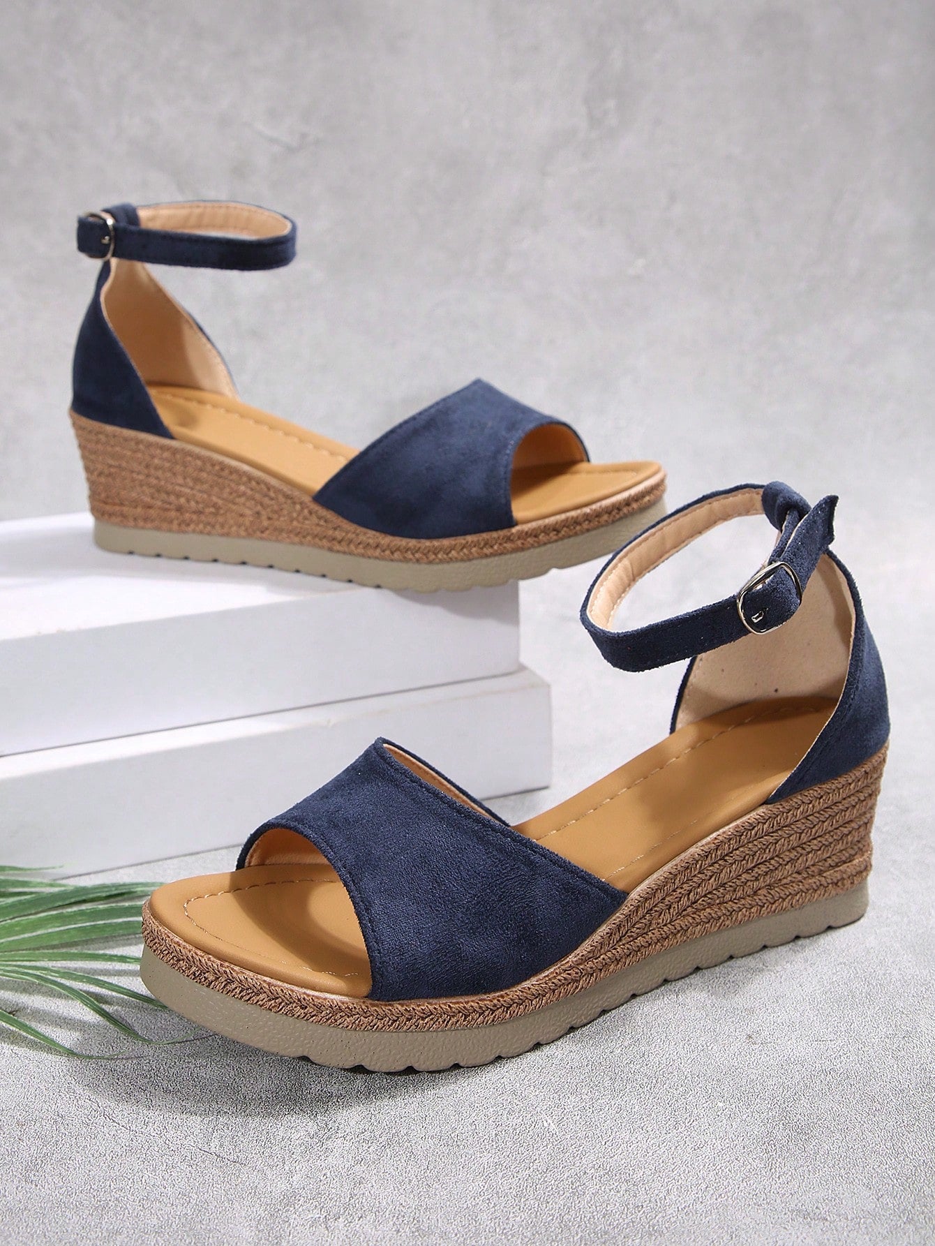 Women's classic wedge sandals featuring a peep open toe, ankle strap with buckle closure, mid wedge heel, and large bow detail in a bohemian beach style.