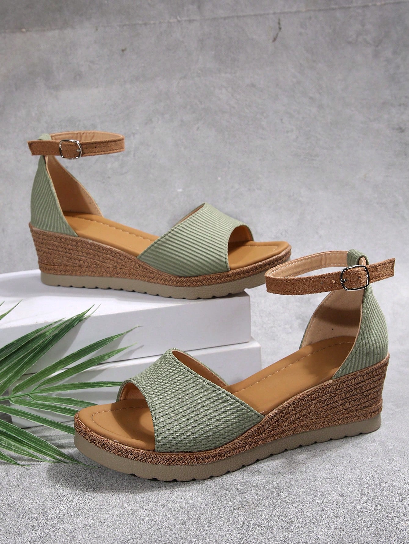 Women's classic wedge sandals featuring a peep open toe, ankle strap with buckle closure, mid wedge heel, and large bow detail in a bohemian beach style.