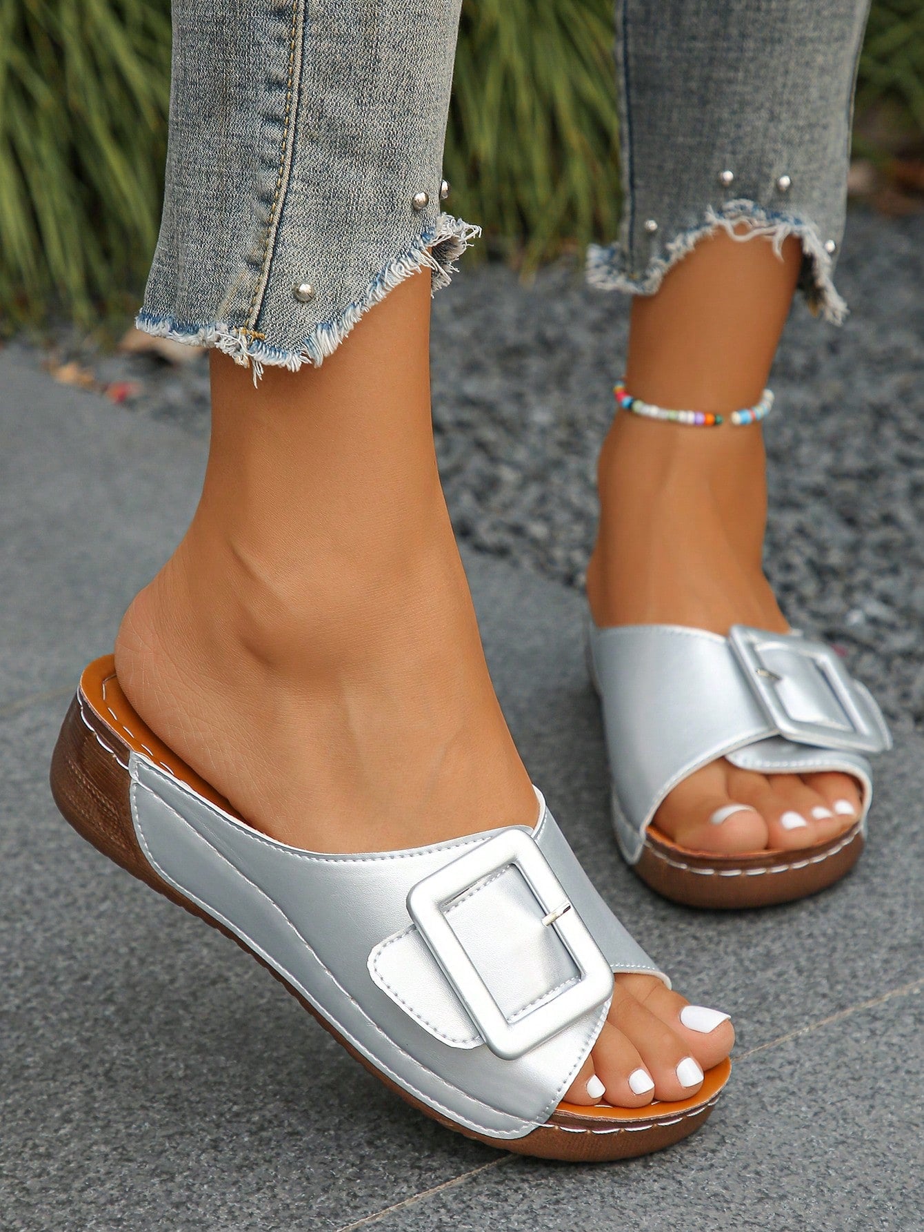 Women’s open toe wedge slide sandals with metal buckle detail and thick low wedge sole, lightweight slip-on style for daily wear, beach, and holiday use.