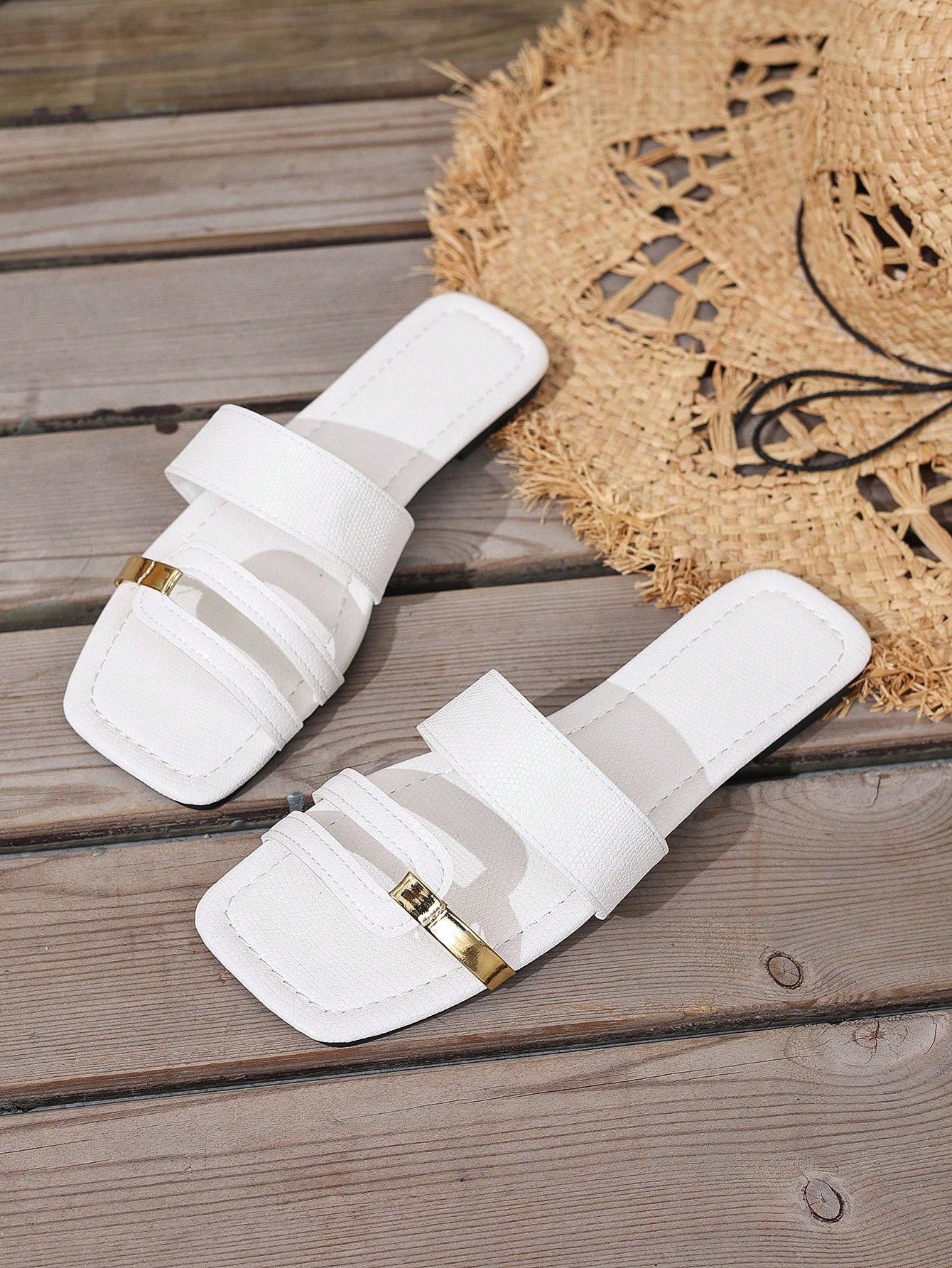 Women's yellow open-toe flat slide sandals featuring a cut-out design and textured plain pattern for casual beach and daily wear.