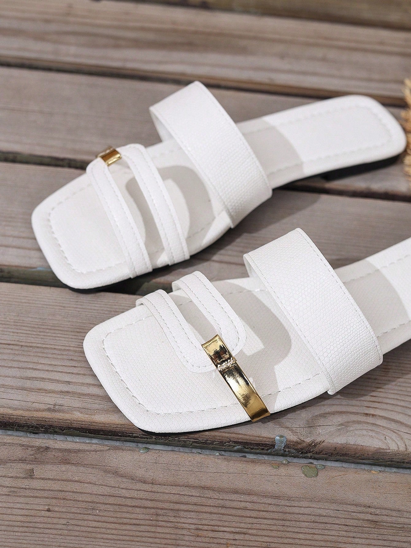 Women's yellow open-toe flat slide sandals featuring a cut-out design and textured plain pattern for casual beach and daily wear.