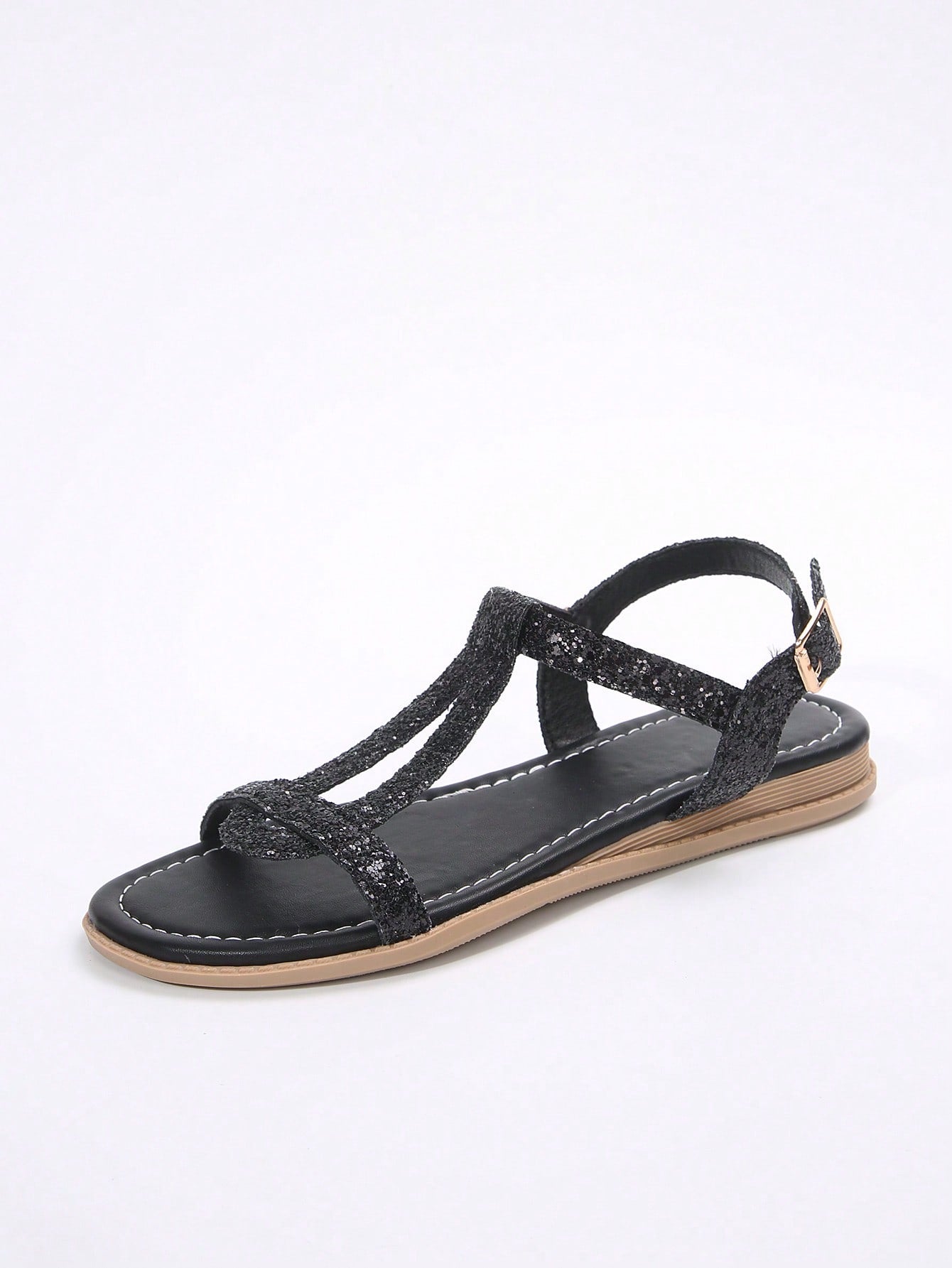 Women’s flat sandals with multiple straps, open toe front, and ankle strap buckle, featuring a plain design with glitter accents in a beach vacation style.