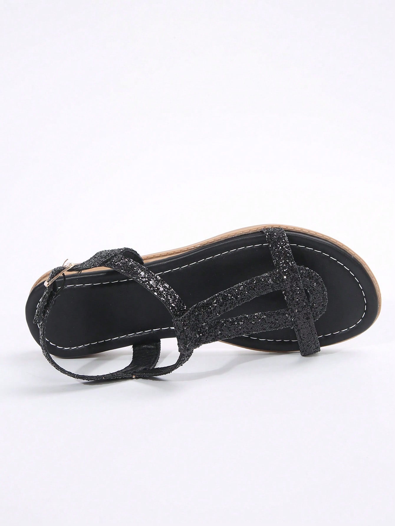 Women’s flat sandals with multiple straps, open toe front, and ankle strap buckle, featuring a plain design with glitter accents in a beach vacation style.
