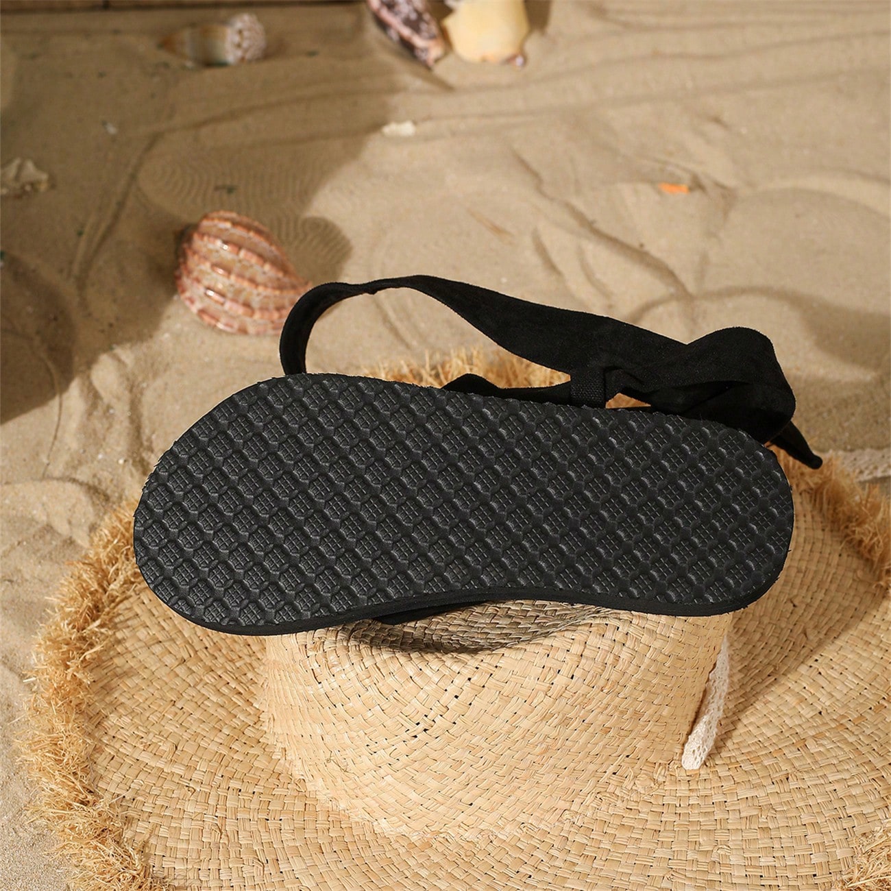 Women's flat gladiator thong sandals with lace-up straps and bow detail in vacation style
