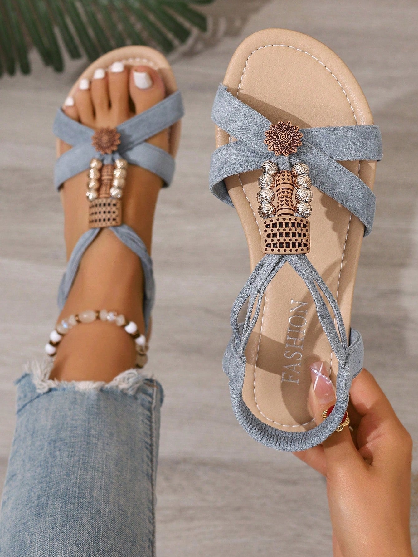 Women's bohemian flat slingback sandals with braided beaded details and open toe, designed for beach and vacation outfits.