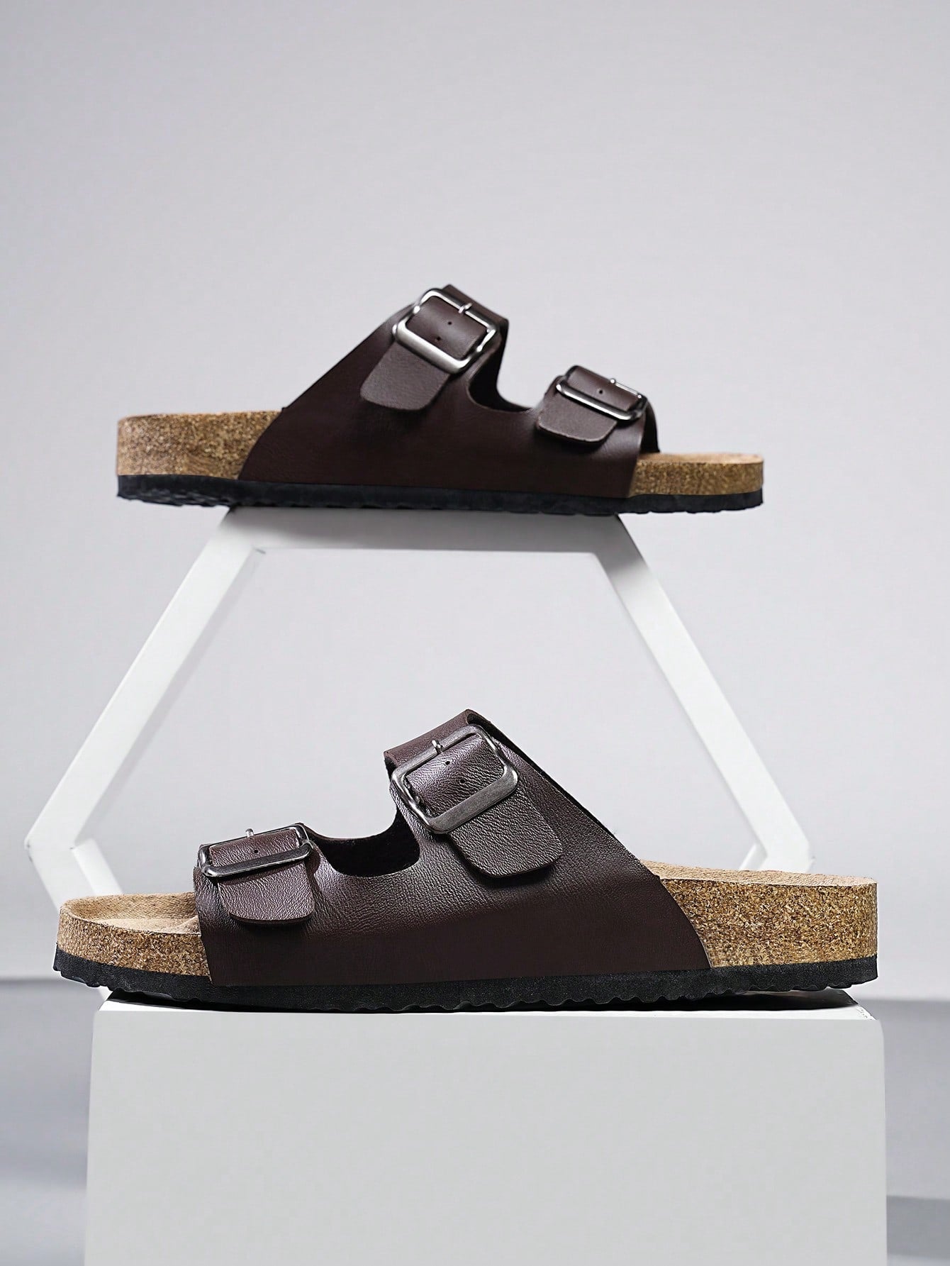 Open-toe footbed slip-on mule sandals with buckle detail and cork-style sole, flat heel design for casual summer home and outdoor walking.