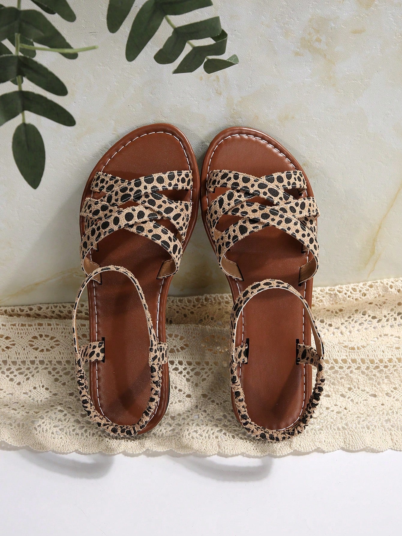 Women's flat thick sole gladiator sandals with cross adjustable straps and open toe, suitable for casual, vacation, and beach wear.