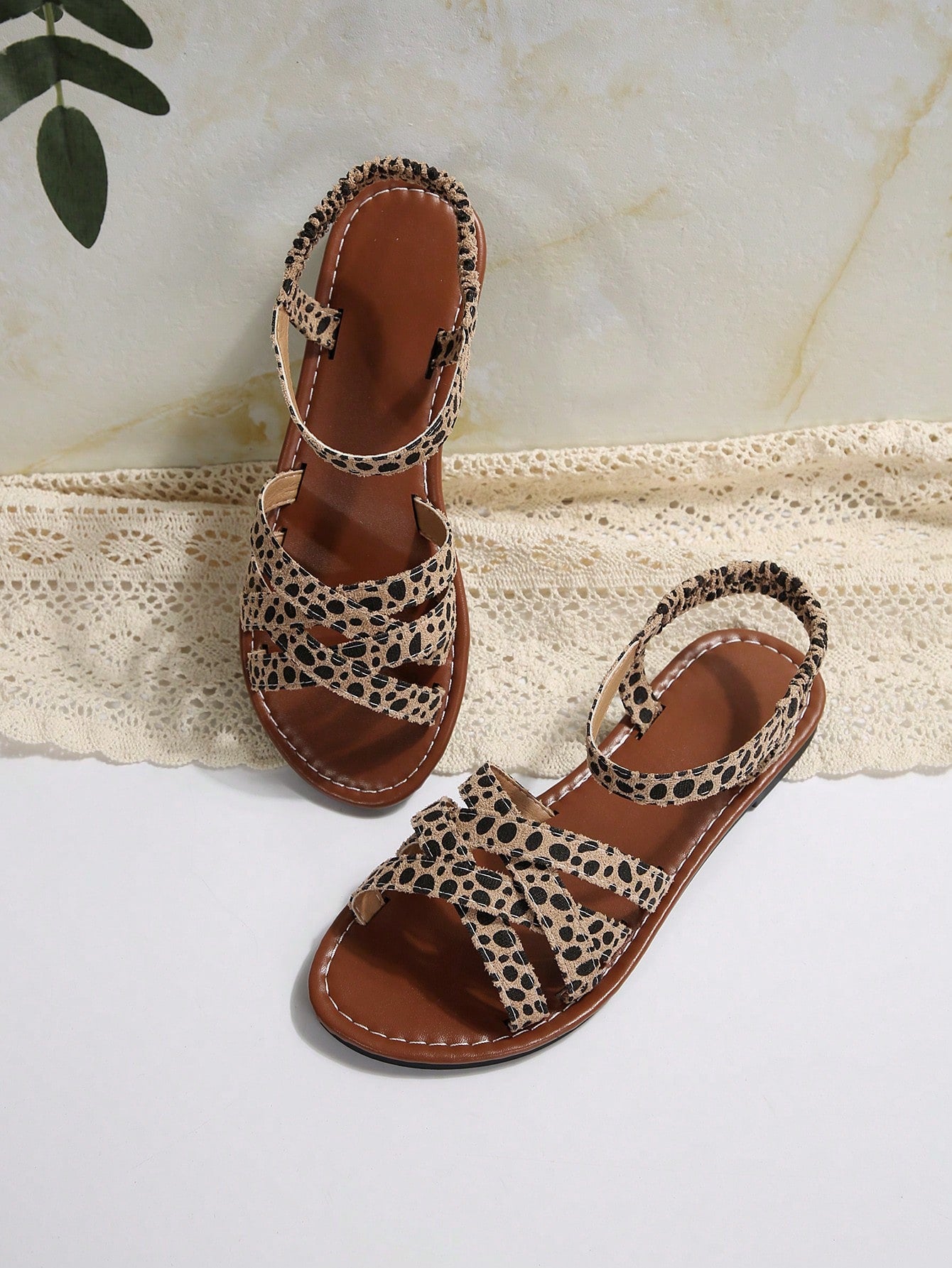 Women's flat thick sole gladiator sandals with cross adjustable straps and open toe, suitable for casual, vacation, and beach wear.