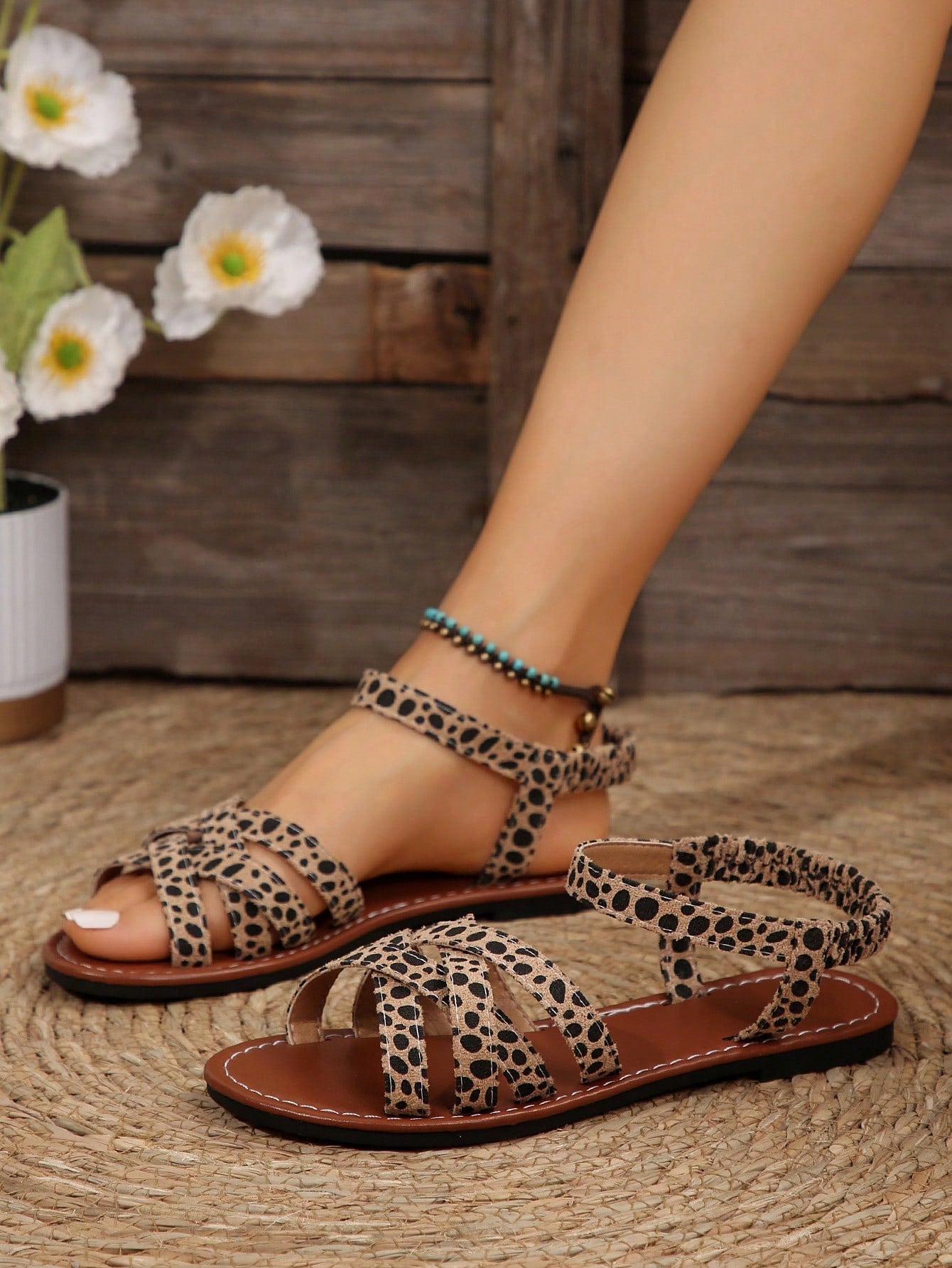 Women's flat thick sole gladiator sandals with cross adjustable straps and open toe, suitable for casual, vacation, and beach wear.