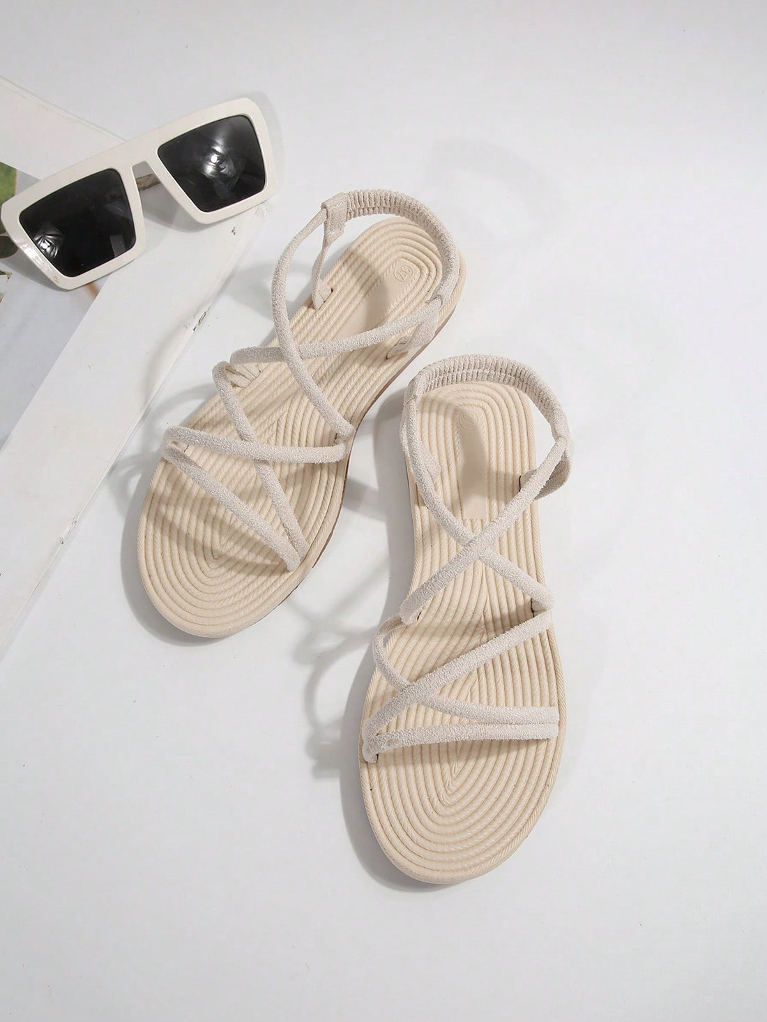 Beige ultra comfy water slide sandals for women and girls with open toe, elastic strap, flat heel, and thick sole, suitable for beach, swimming, hiking, sports, and travel.
