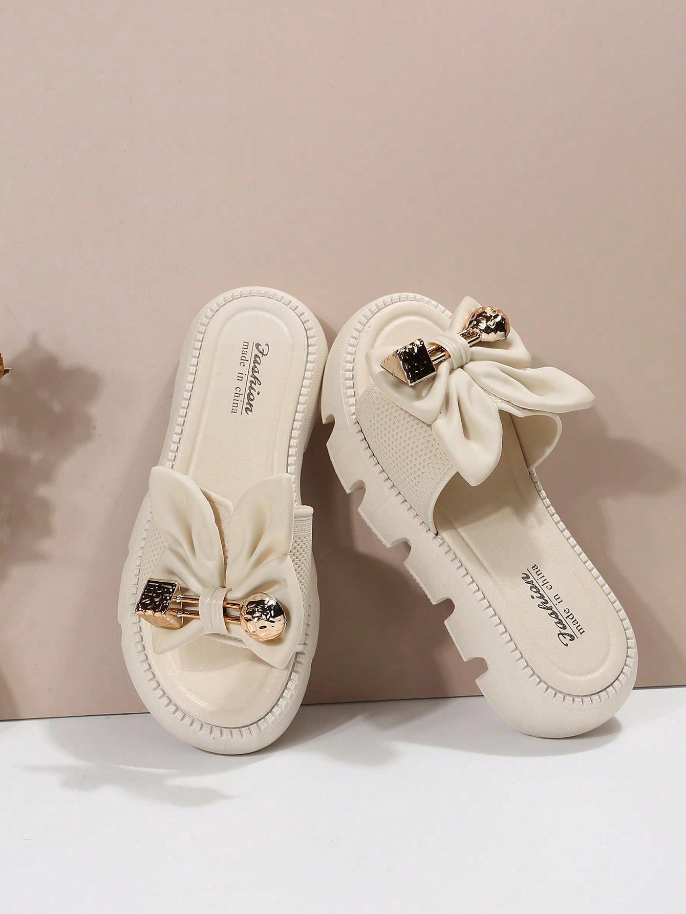 Women's plus size thick sole slip-on sandals with bowknot detail, open toe design, low heel, and PU leather upper.