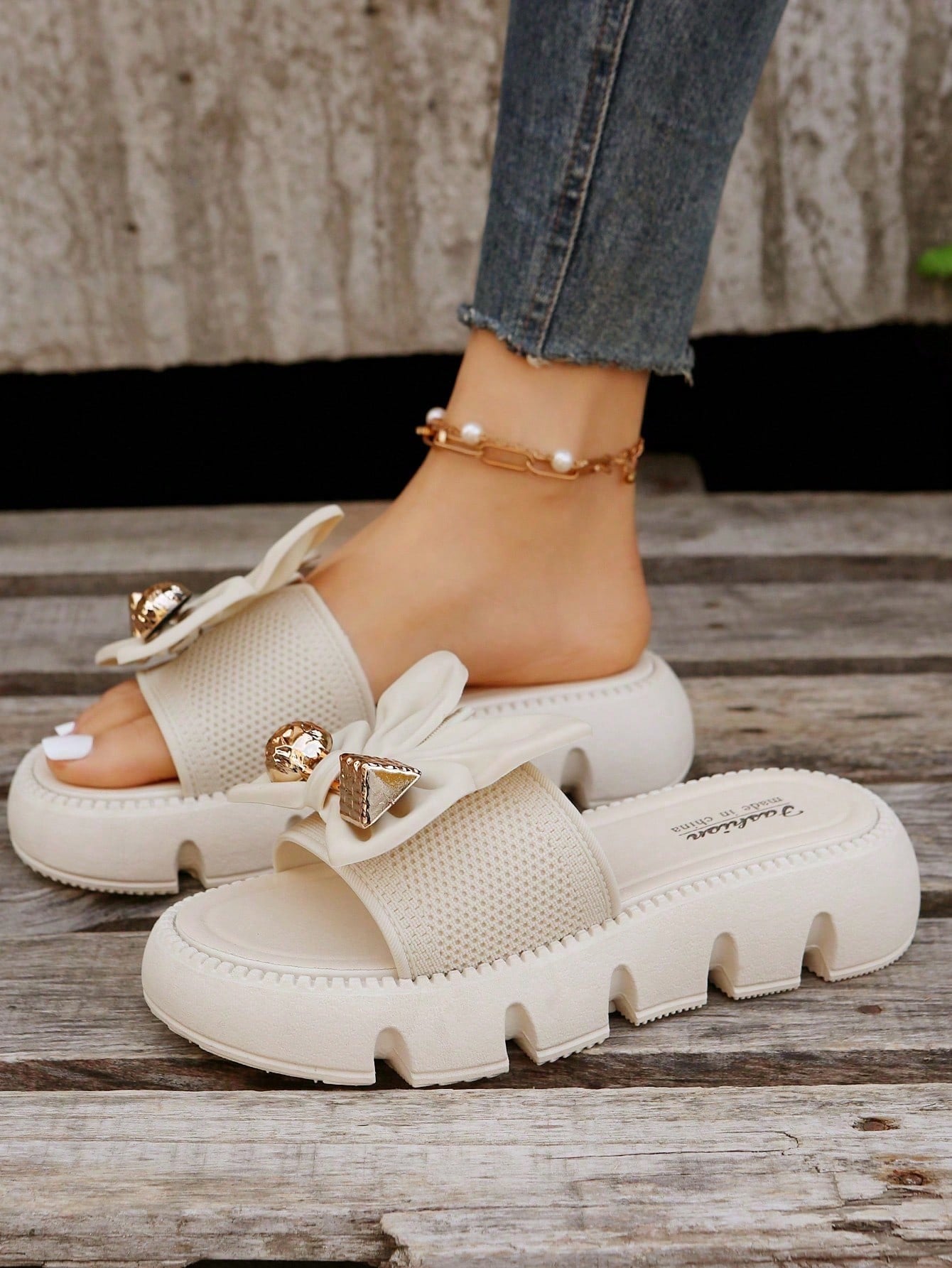 Women's plus size thick sole slip-on sandals with bowknot detail, open toe design, low heel, and PU leather upper.