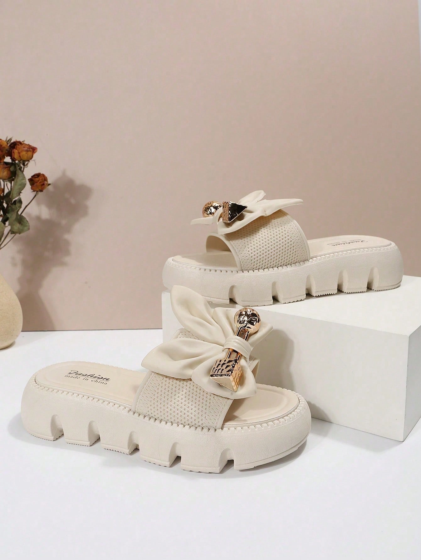 Women's plus size thick sole slip-on sandals with bowknot detail, open toe design, low heel, and PU leather upper.
